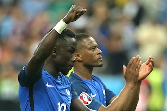 PARIS, FRANCE - JUNE 10: Bacary Sagna and Patrice Evra of France celebrate the victory following the UEFA Euro 2016 Group A opening match between France and Romania at Stade de France on June 10, 2016 in Saint-Denis near Paris, France. (Photo by Jean Catu