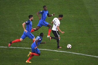 MARSEILLE, FRANCE - JULY 07:  Emre Can of Germany runs with the ball under pressure from Blaise Matuidi, Olivier Giroud and Pogba of France during the UEFA EURO semi final match between Germany and France at Stade Velodrome on July 7, 2016 in Marseille, F