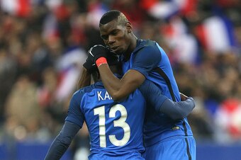 PARIS, FRANCE - MARCH 29:  N'Golo Kante of France celebrates his goal with Paul Pogba of France during the international friendly match between France and Russia at Stade de France on March 29, 2016 in Saint-Denis near Paris, France.  (Photo by Jean Catuf
