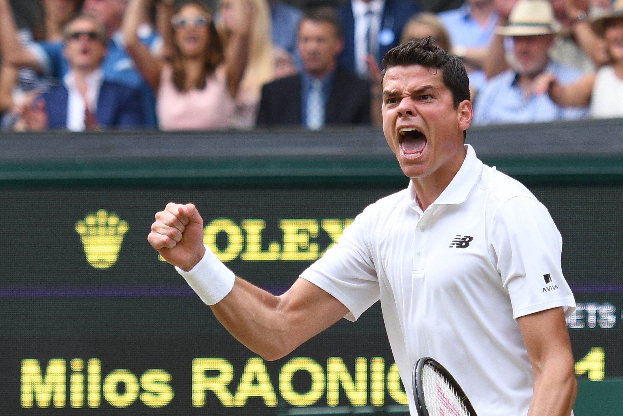 Canada's Milos Raonic celebrates winning the fourth set against Switzerland's Roger Federer during their men's semi-final match on the twelfth day of the 2016 Wimbledon Championships at The All England Lawn Tennis Club in Wimbledon, southwest London, on J