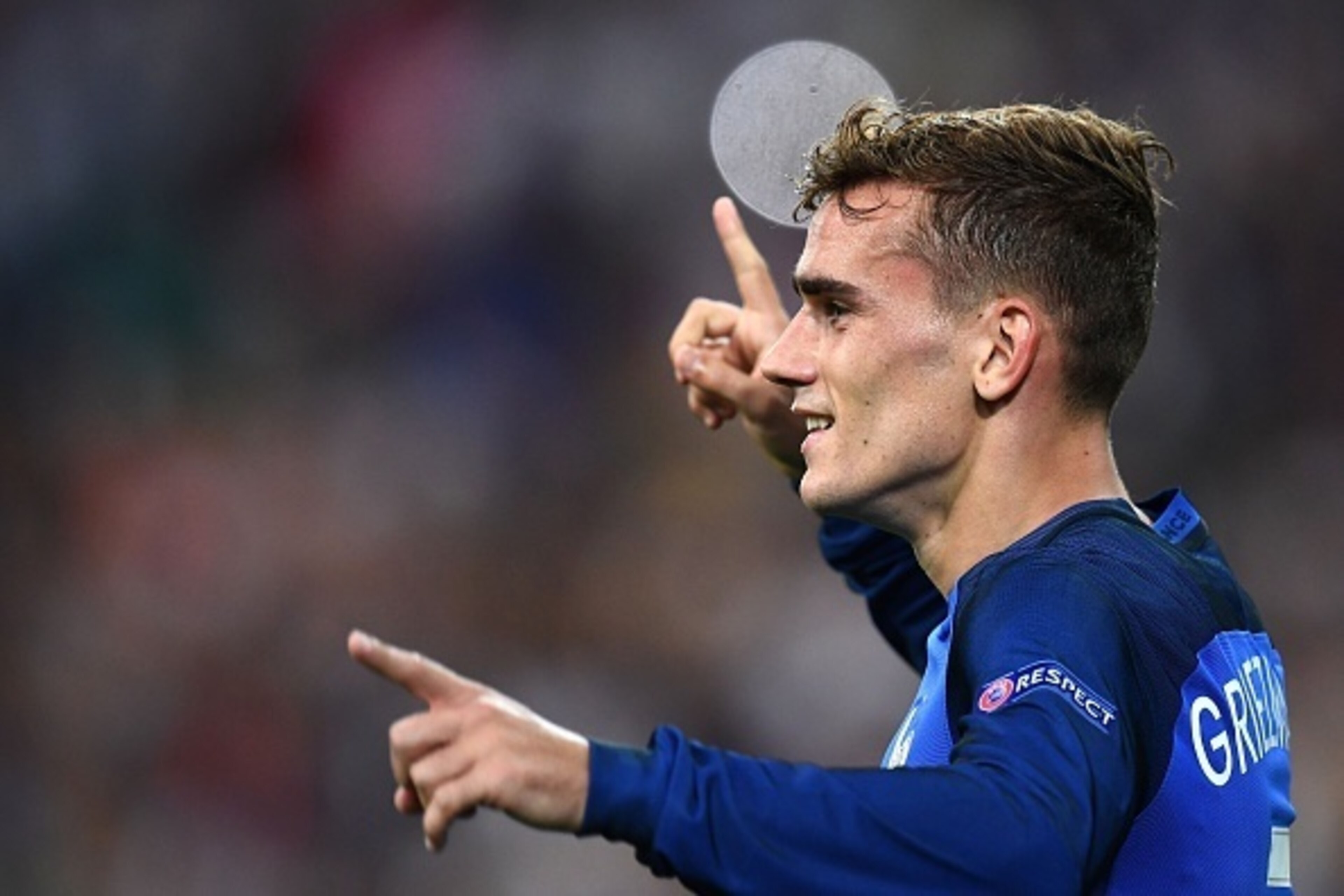 France's forward Antoine Griezmann celebrates after scoring the second goal for France during the Euro 2016 semi-final football match between Germany and France at the Stade Velodrome in Marseille on July 7, 2016. / AFP / FRANCK FIFE        (Photo credit
