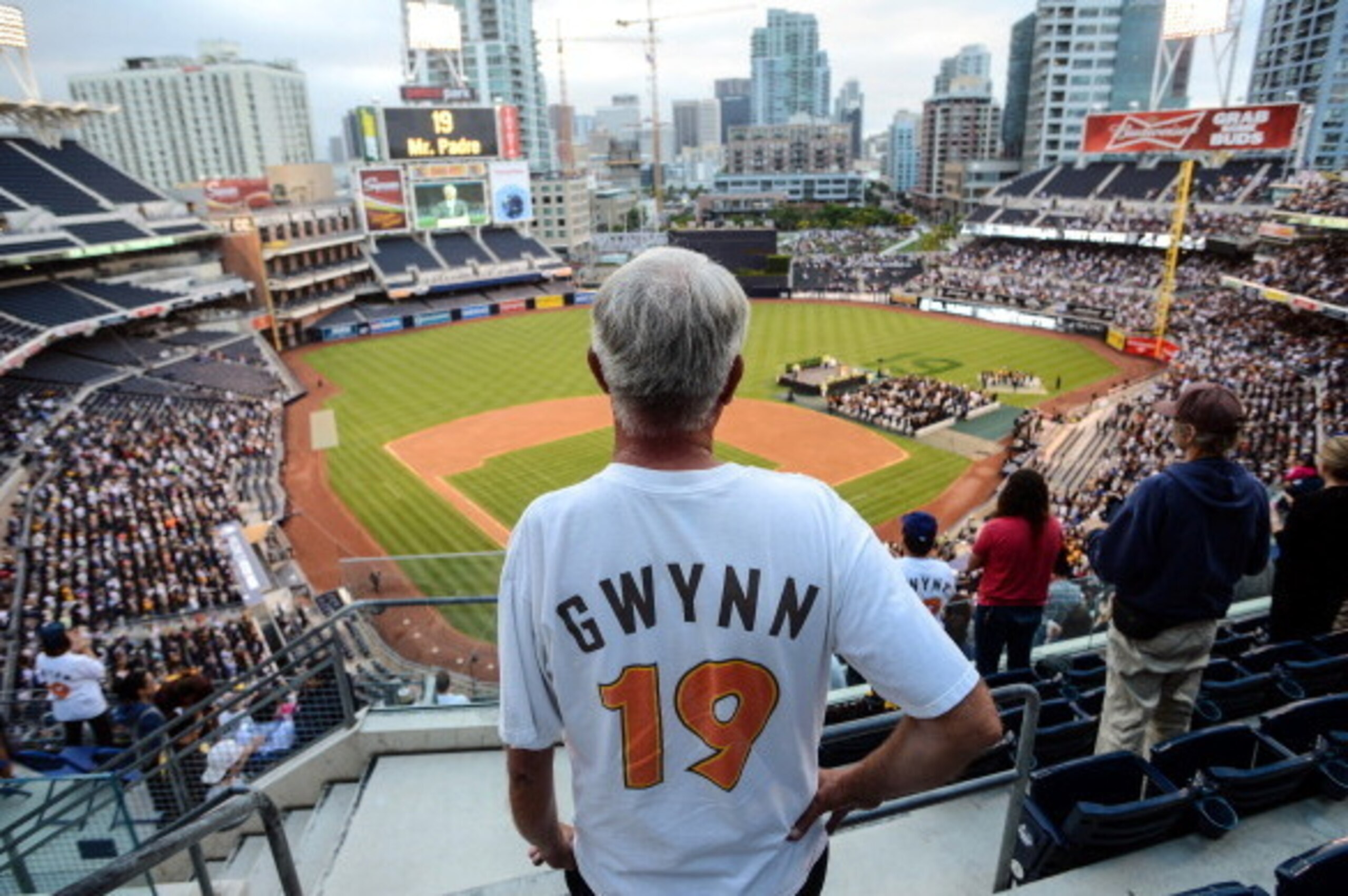 SAN DIEGO, CA - JUNE 26:  Fans wearing replica jerseys stand for the opening ceremonies celebrating Hall of Famer Tony Gwynn, Sr.'s life and career as a San Diego Padre at Petco Park on June 26, 2014 in San Diego, California. (Photo by Kent C. Horner/Gett