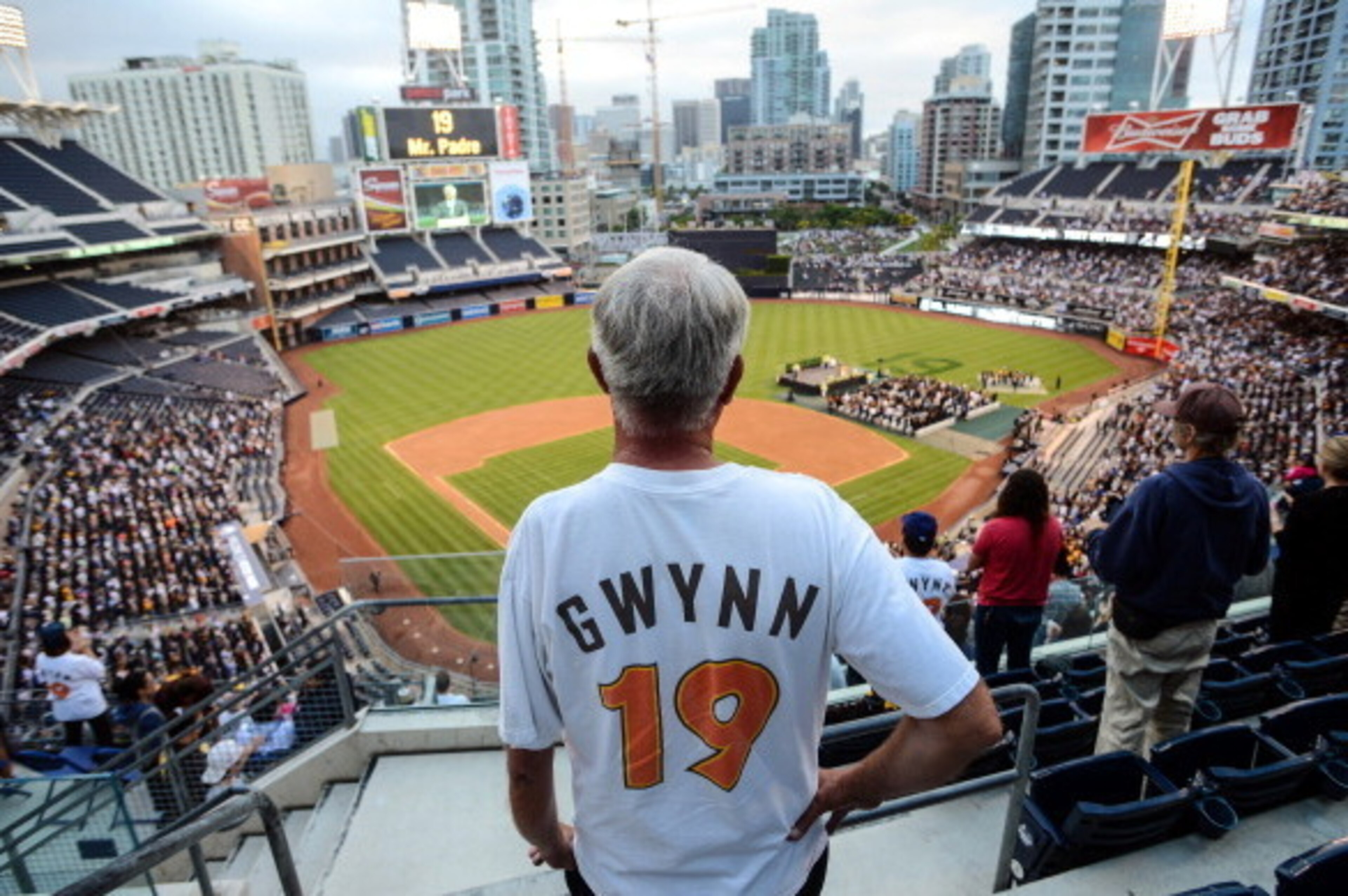 SAN DIEGO, CA - JUNE 26:  Fans wearing replica jerseys stand for the opening ceremonies celebrating Hall of Famer Tony Gwynn, Sr.'s life and career as a San Diego Padre at Petco Park on June 26, 2014 in San Diego, California. (Photo by Kent C. Horner/Gett