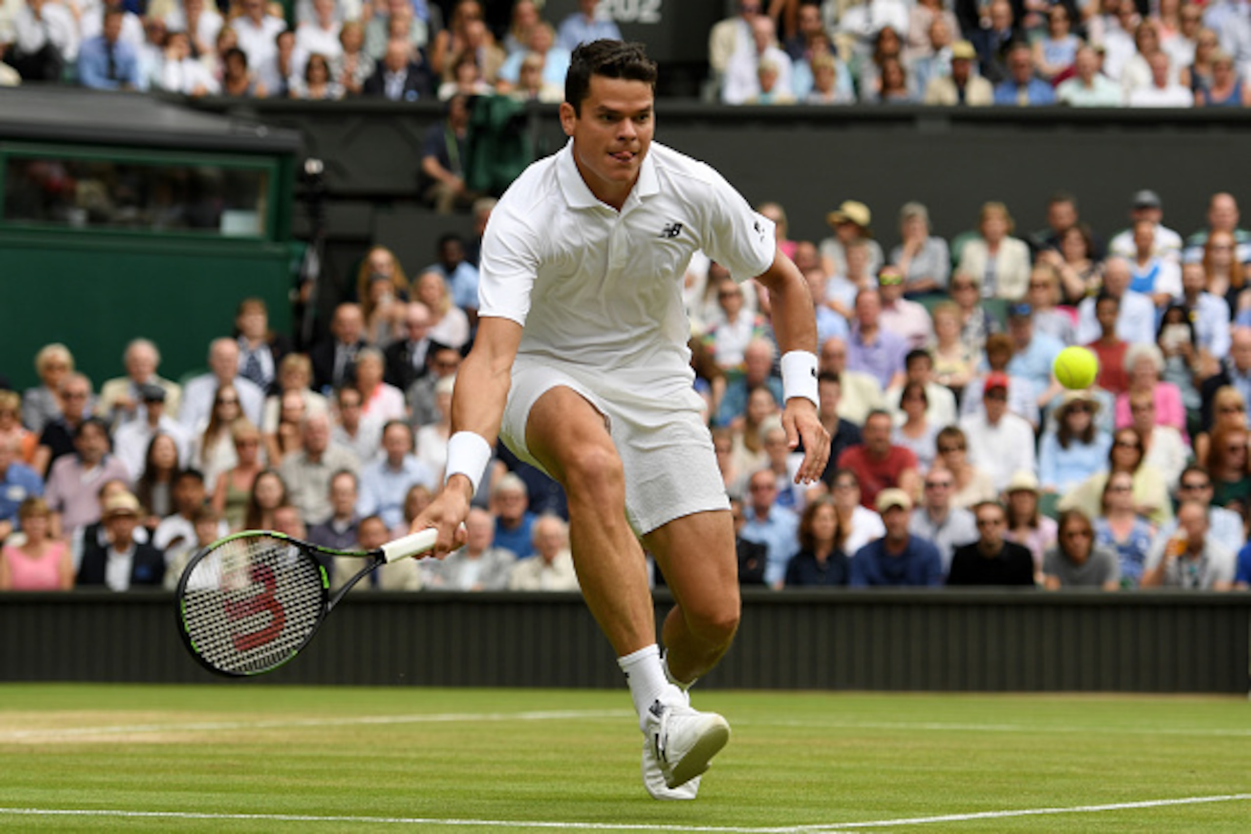 LONDON, ENGLAND - JULY 08:  Milos Raonic of Canada plays a forehand during the Men's Singles Semi Final match against Roger Federer of Switzerland on day eleven of the Wimbledon Lawn Tennis Championships at the All England Lawn Tennis and Croquet Club on 