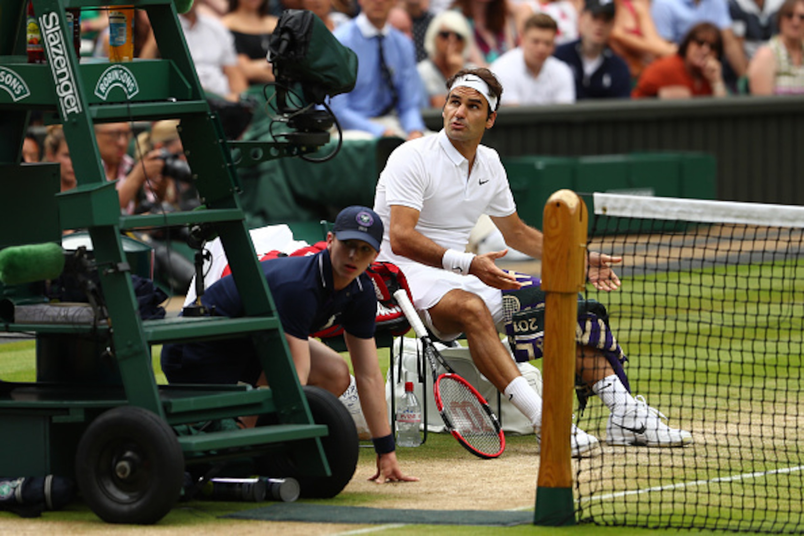 LONDON, ENGLAND - JULY 08:  Roger Federer of Switzerland speaks to The Umpire during the Men's Singles Semi Final match against Milos Raonic of Canada on day eleven of the Wimbledon Lawn Tennis Championships at the All England Lawn Tennis and Croquet Club