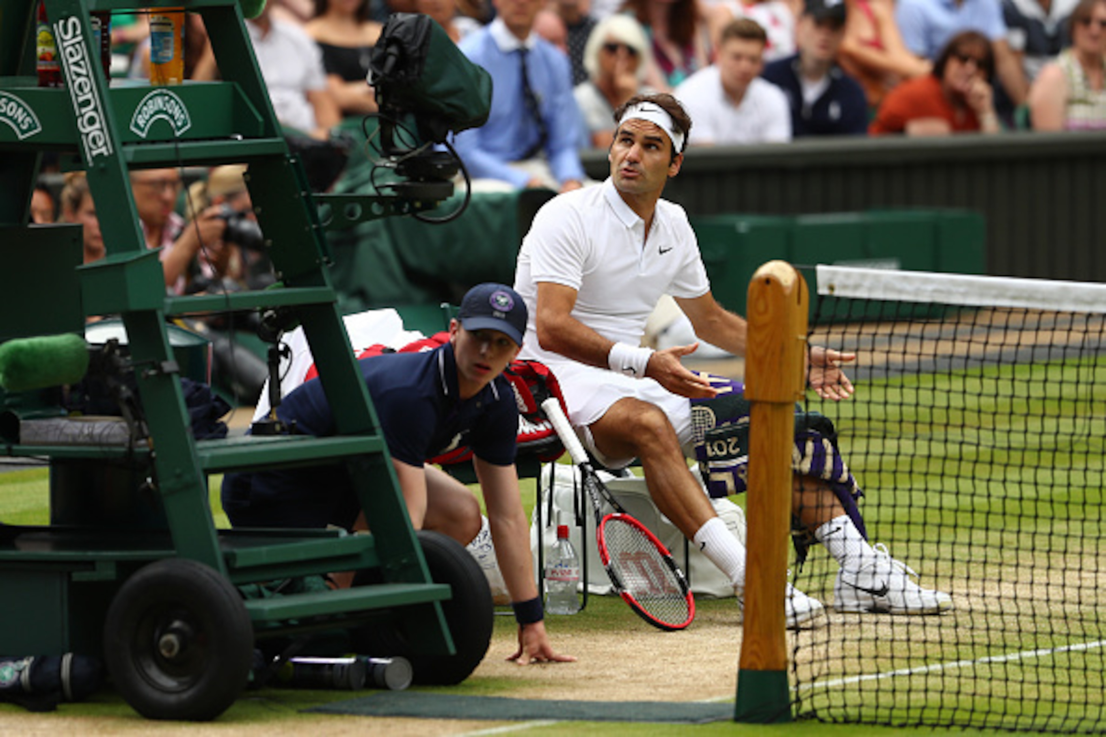 LONDON, ENGLAND - JULY 08:  Roger Federer of Switzerland speaks to The Umpire during the Men's Singles Semi Final match against Milos Raonic of Canada on day eleven of the Wimbledon Lawn Tennis Championships at the All England Lawn Tennis and Croquet Club