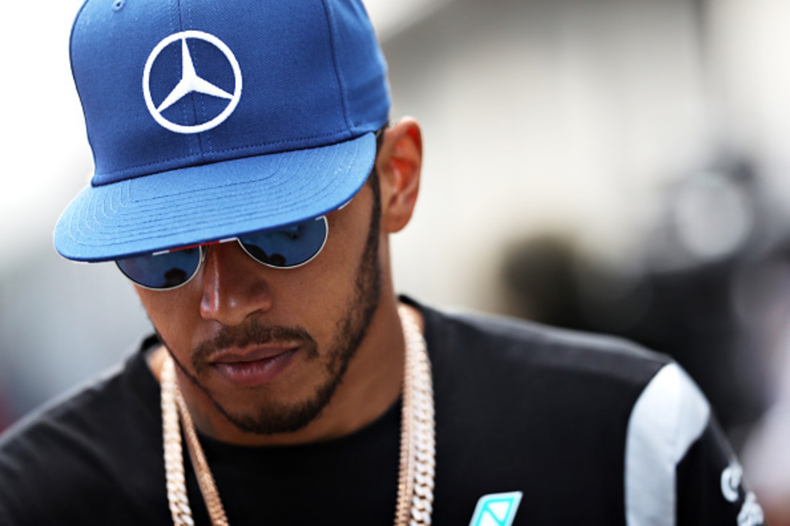 NORTHAMPTON, ENGLAND - JULY 08:  Lewis Hamilton of Great Britain and Mercedes GP walks in the Paddock after practice for the Formula One Grand Prix of Great Britain at Silverstone on July 8, 2016 in Northampton, England.  (Photo by Mark Thompson/Getty Ima