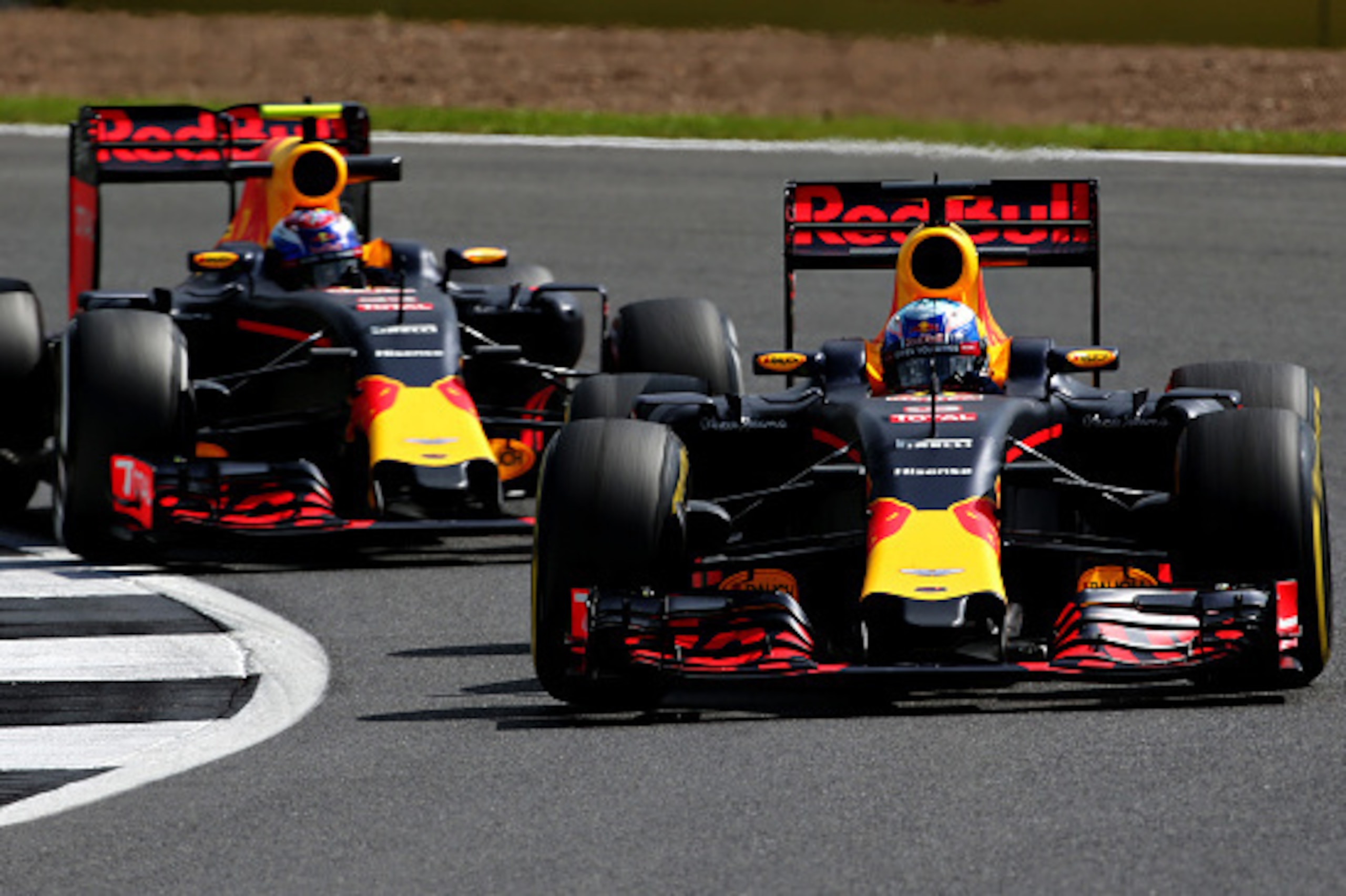 NORTHAMPTON, ENGLAND - JULY 08: Daniel Ricciardo of Australia driving the (3) Red Bull Racing Red Bull-TAG Heuer RB12 TAG Heuer on track ahead of Max Verstappen of the Netherlands driving the (33) Red Bull Racing Red Bull-TAG Heuer RB12 TAG Heuer during p