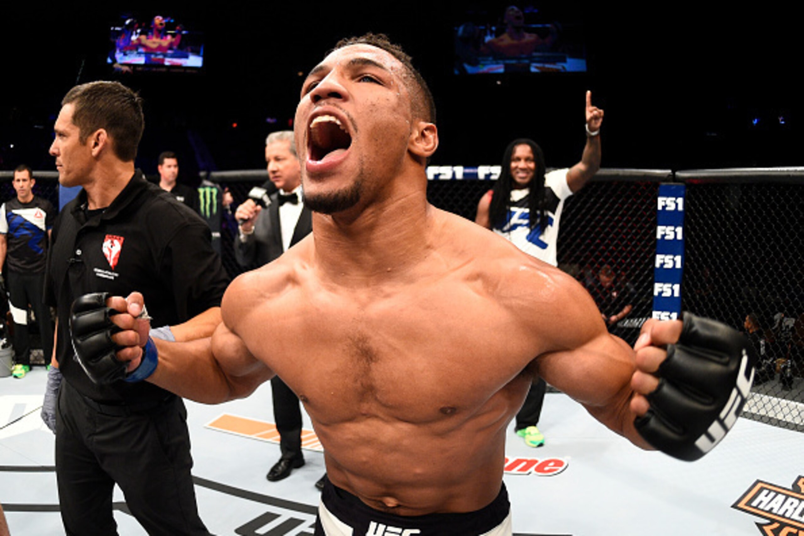LAS VEGAS, NV - JULY 08:  Kevin Lee celebrates after his TKO victory over Jake Matthews of Australia in their lightweight bout during The Ultimate Fighter Finale event at MGM Grand Garden Arena on July 8, 2016 in Las Vegas, Nevada.  (Photo by Jeff Bottari