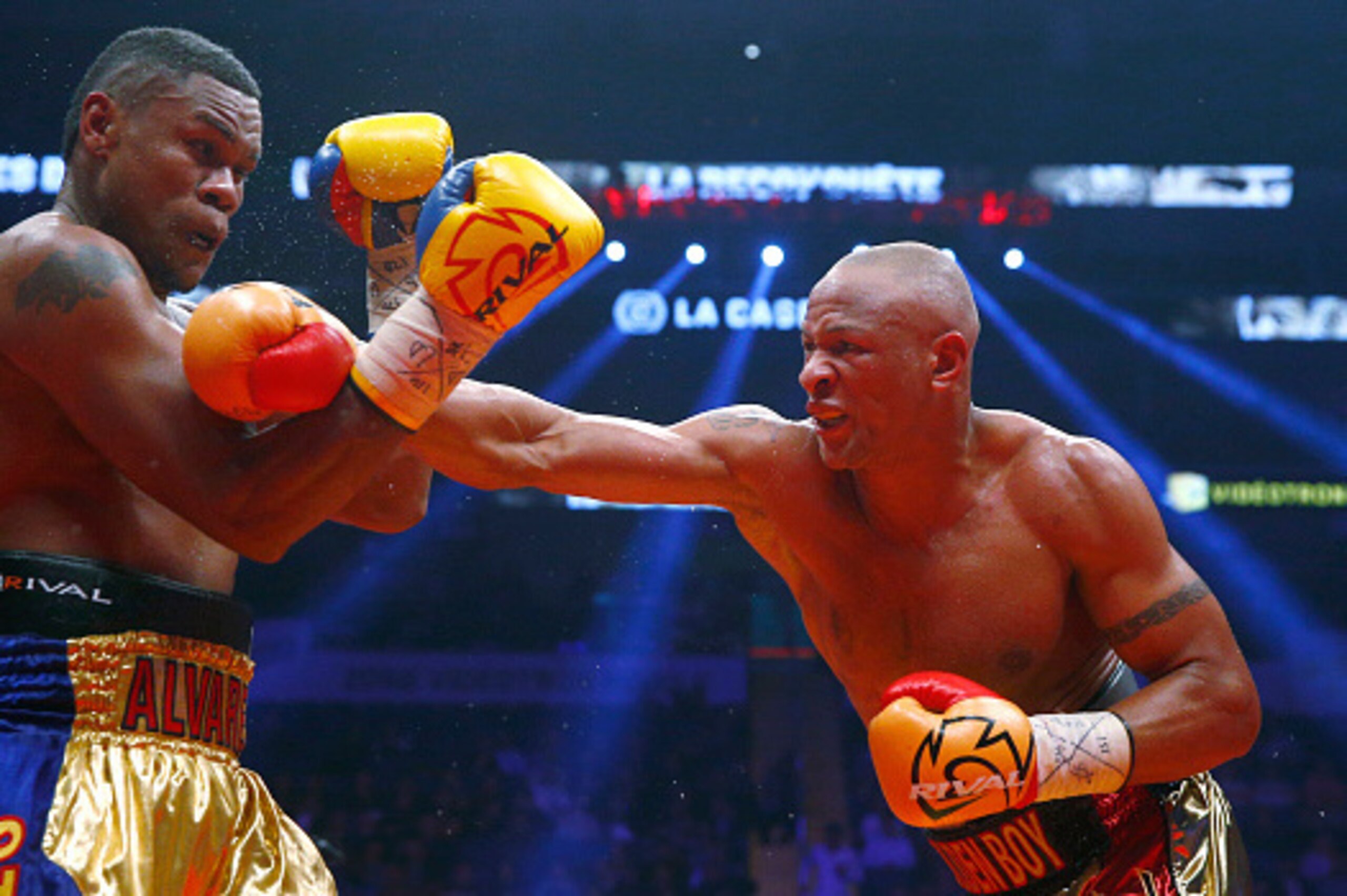 QUEBEC CITY, QC - NOVEMBER 28: Isaac Chilemba of South Africa throws a punch to  Eleider Alvarez of Columbia during their WBC elimination fight at the Centre Videotron on November 28, 2015 in Quebec City, Quebec, Canada. (Photo by Mathieu Belanger/Getty I