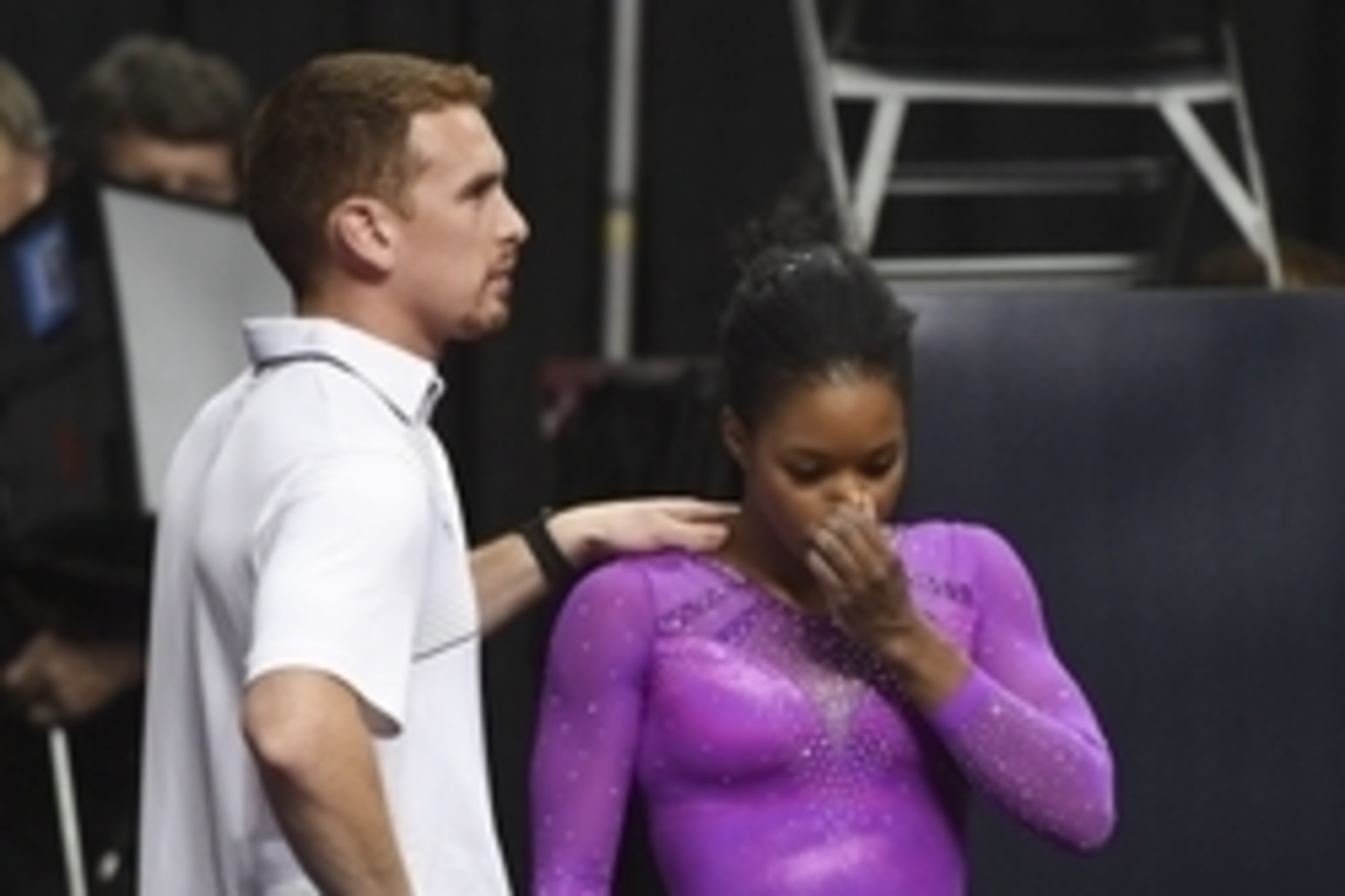 July 8, 2016; San Jose, CA, USA; Gabby Douglas (right), from Tarzana, CA, reacts with coach Christian Gallardo (left) after the balance beam in the women's gymnastics U.S. Olympic team trials at SAP Center. Mandatory Credit: Kyle Terada-USA TODAY Sports