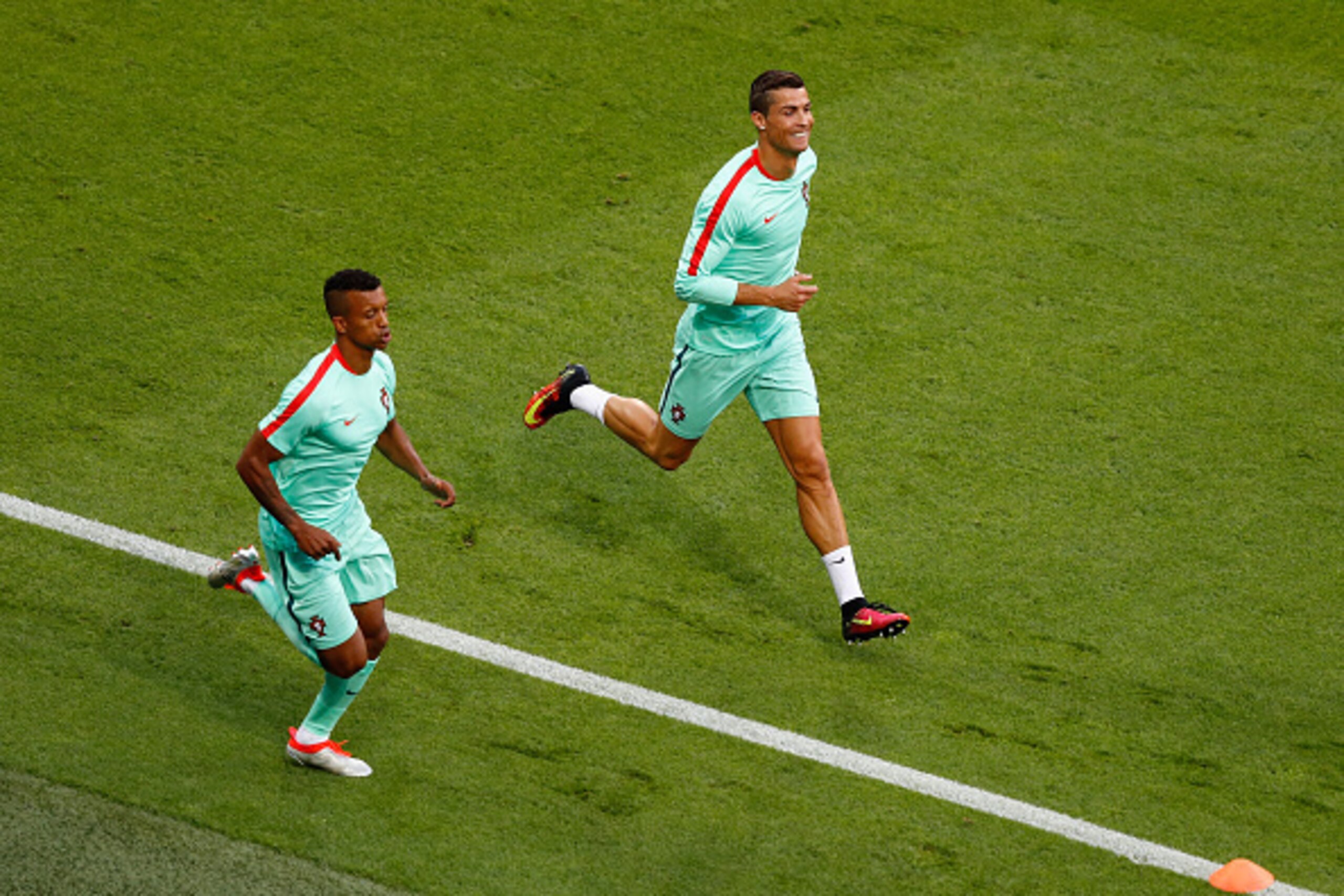 LYON, FRANCE - JULY 06:  Cristiano Ronaldo (R) and Nani (L) of Portugal warm up prior to the UEFA EURO 2016 semi final match between Wales and Portugal at Stade des Lumieres on July 6, 2016 in Lyon, France.  (Photo by Clive Rose/Getty Images)