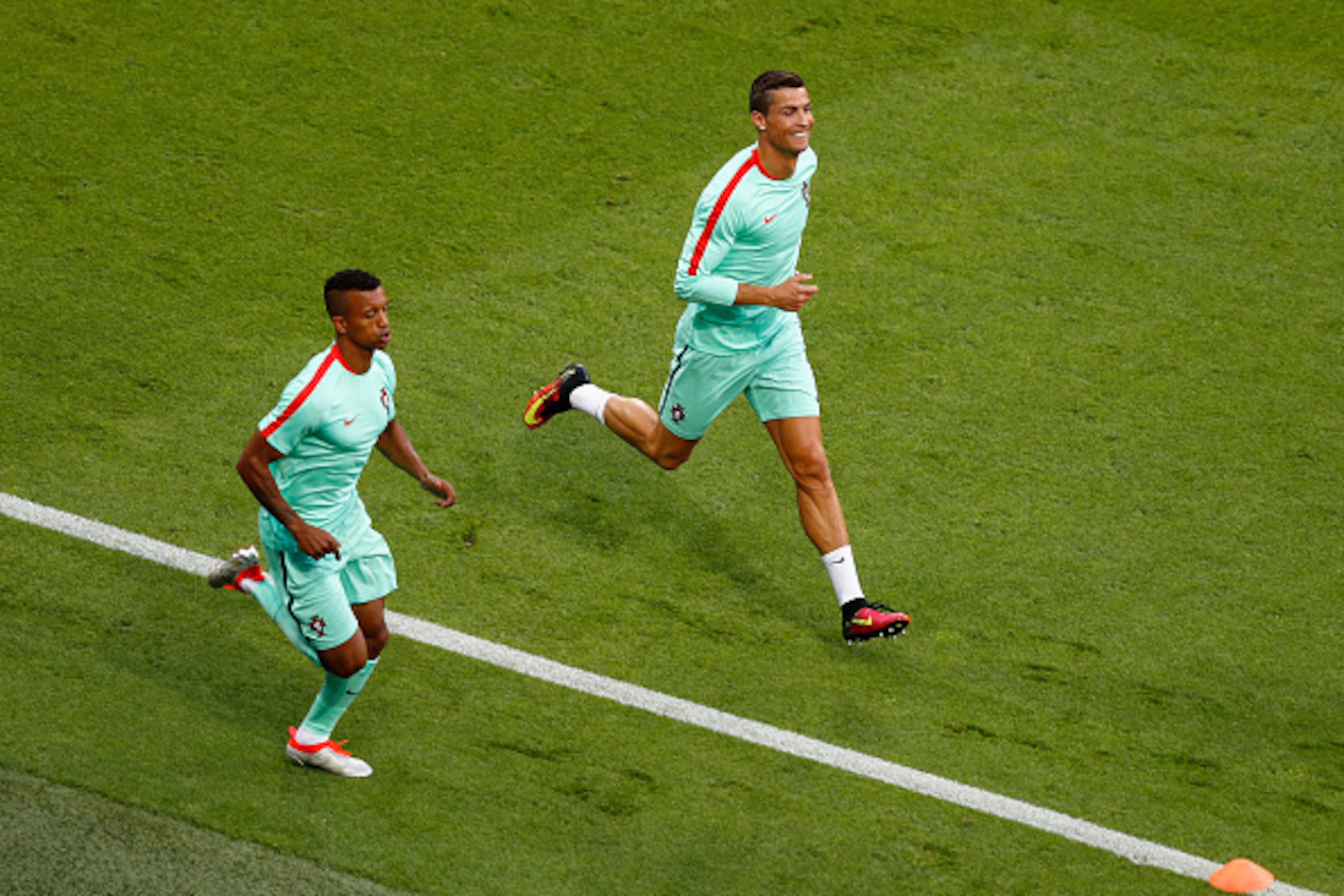 LYON, FRANCE - JULY 06:  Cristiano Ronaldo (R) and Nani (L) of Portugal warm up prior to the UEFA EURO 2016 semi final match between Wales and Portugal at Stade des Lumieres on July 6, 2016 in Lyon, France.  (Photo by Clive Rose/Getty Images)