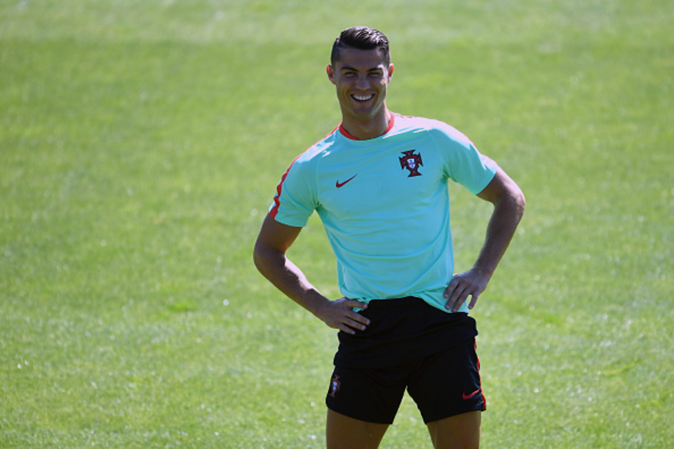 PARIS, FRANCE - JULY 09:  Cristiano Ronaldo of Portugal in good heart during a Portugal training session, ahead of the UEFA Euro 2016 Final between France and Portugal, at the Centre National de Rugby on July 9, 2016 in Carcoussis, France.  (Photo by Mike