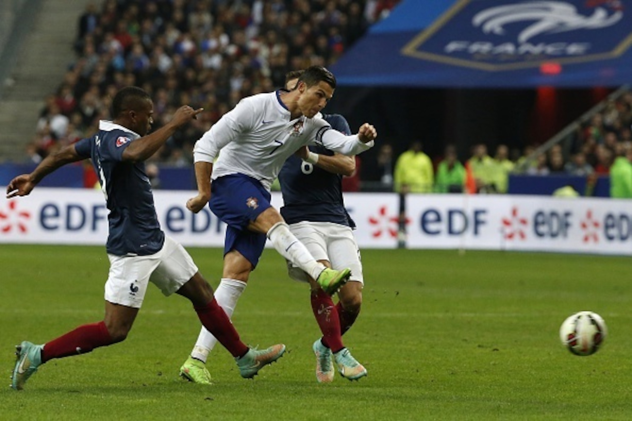 Portugal's forward and Captain Cristiano Ronaldo kicks the ball during the friendly football match France vs Portugal on October 11, 2014, at the Stade de France in Saint-Denis, northern Paris. AFP PHOTO THOMAS SAMSON        (Photo credit should read THOM