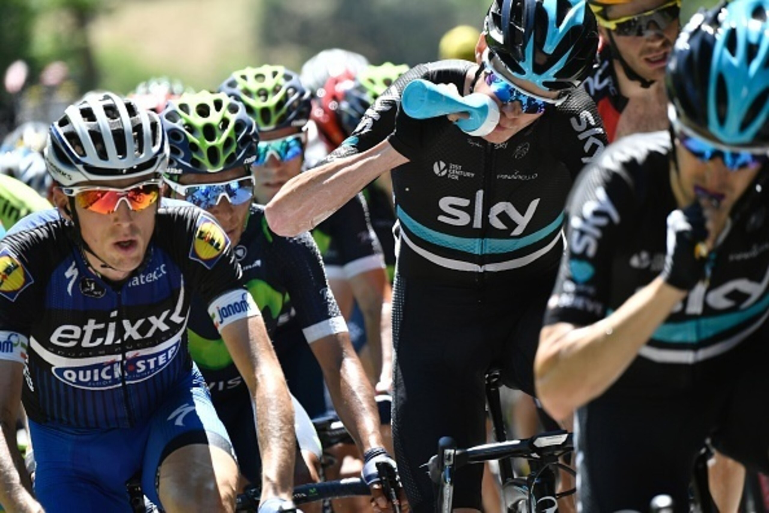 Great Britain's Christopher Froome (3rdR) drinks water next to Colombia's Nairo Quintana (2ndL) as they rides during the 184 km eighth stage of the 103rd edition of the Tour de France cycling race on July 9, 2016 between Pau and Bagneres-de-Luchon. / AFP 