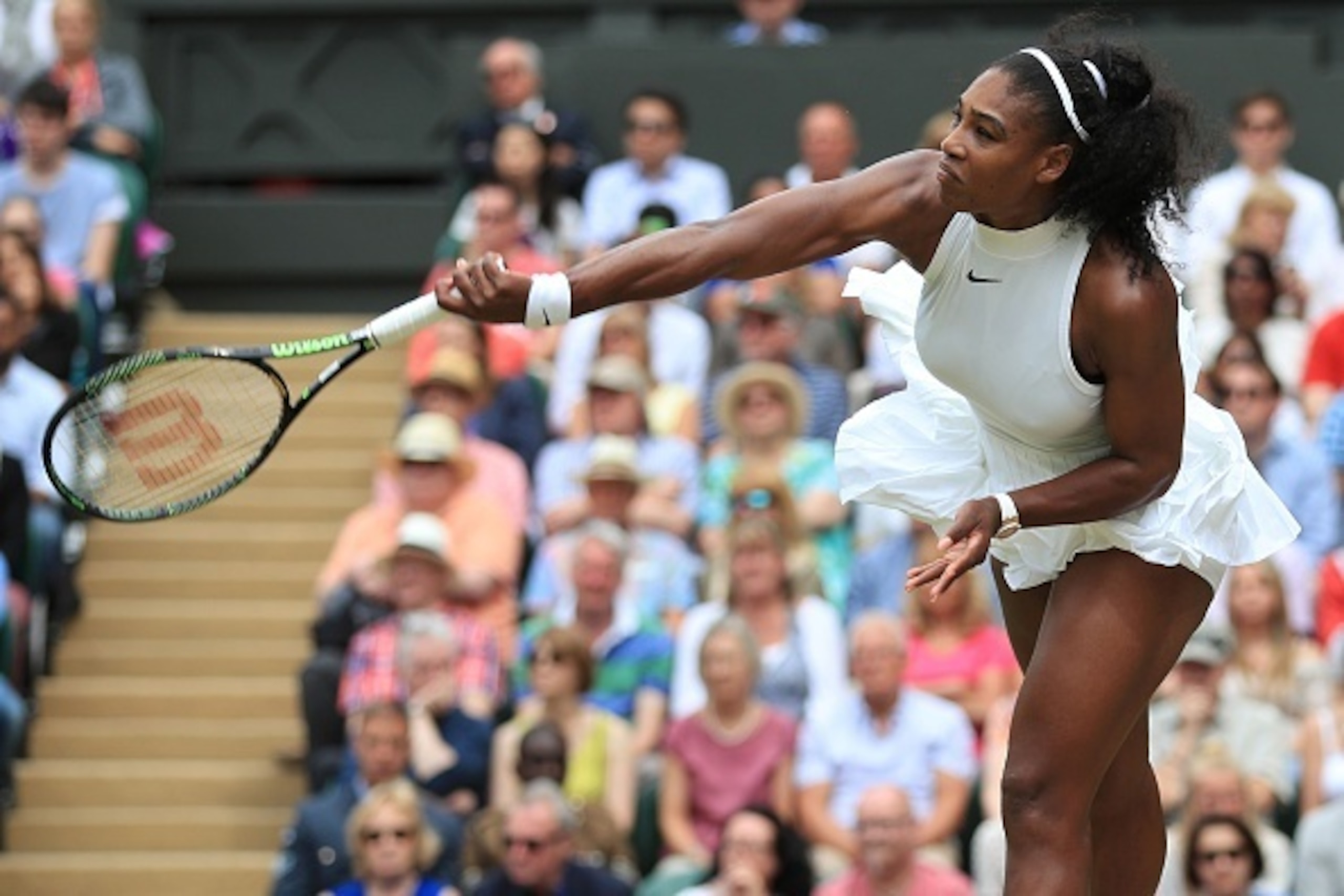 US player Serena Williams serves against Germany's Angelique Kerber during the women's singles final on the thirteenth day of the 2016 Wimbledon Championships at The All England Lawn Tennis Club in Wimbledon, southwest London, on July 9, 2016. / AFP / POO