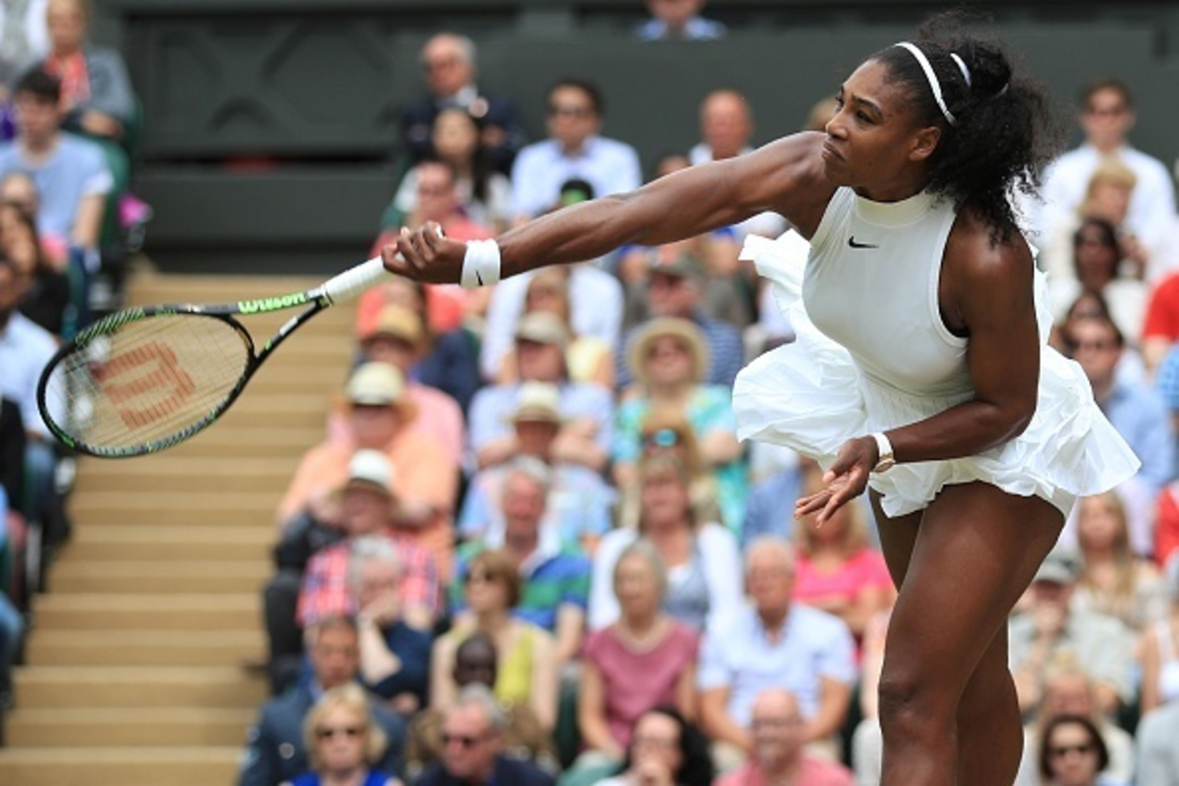 US player Serena Williams serves against Germany's Angelique Kerber during the women's singles final on the thirteenth day of the 2016 Wimbledon Championships at The All England Lawn Tennis Club in Wimbledon, southwest London, on July 9, 2016. / AFP / POO