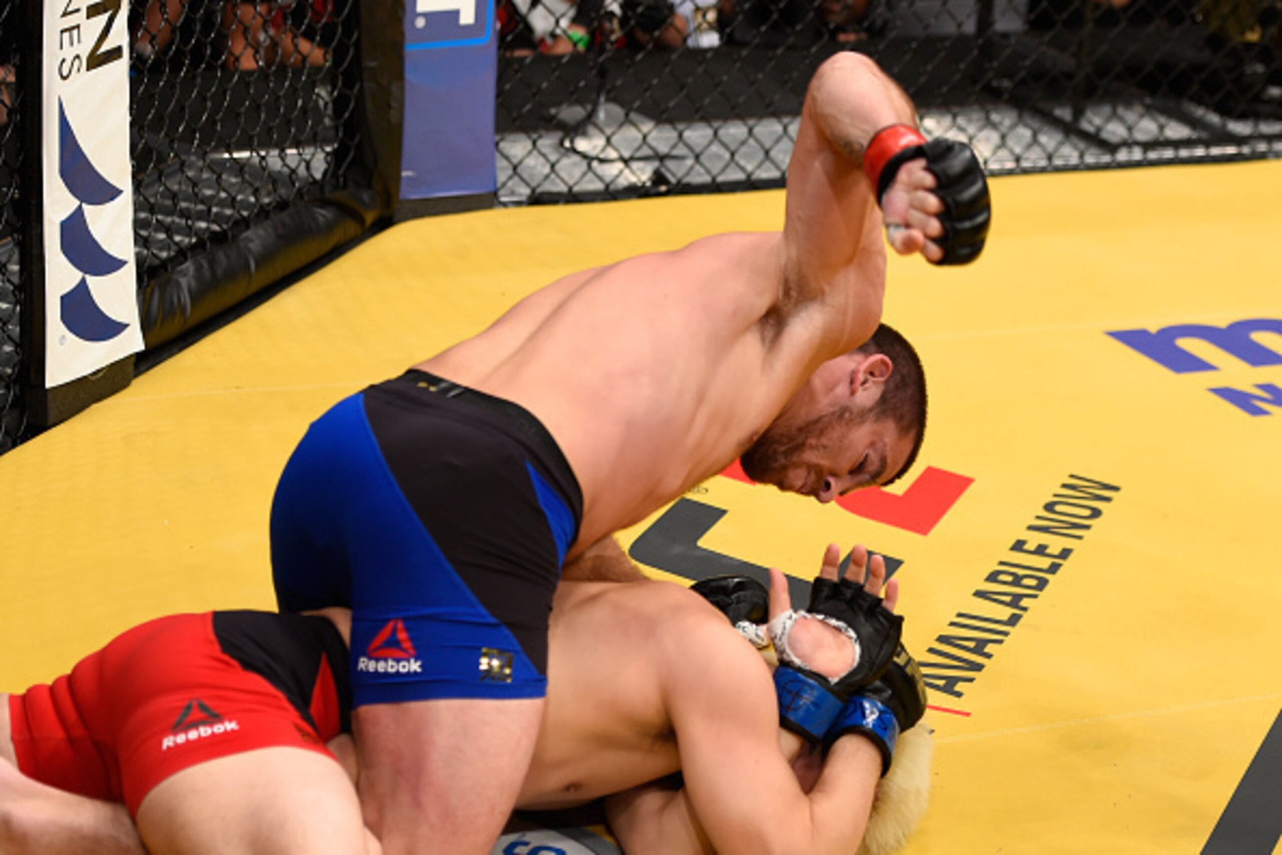 LAS VEGAS, NV - JULY 09:  Jim Miller (top) punches Takanori Gomi of Japan in their lightweight bout during the UFC 200 event on July 9, 2016 at T-Mobile Arena in Las Vegas, Nevada.  (Photo by Josh Hedges/Zuffa LLC/Zuffa LLC via Getty Images)