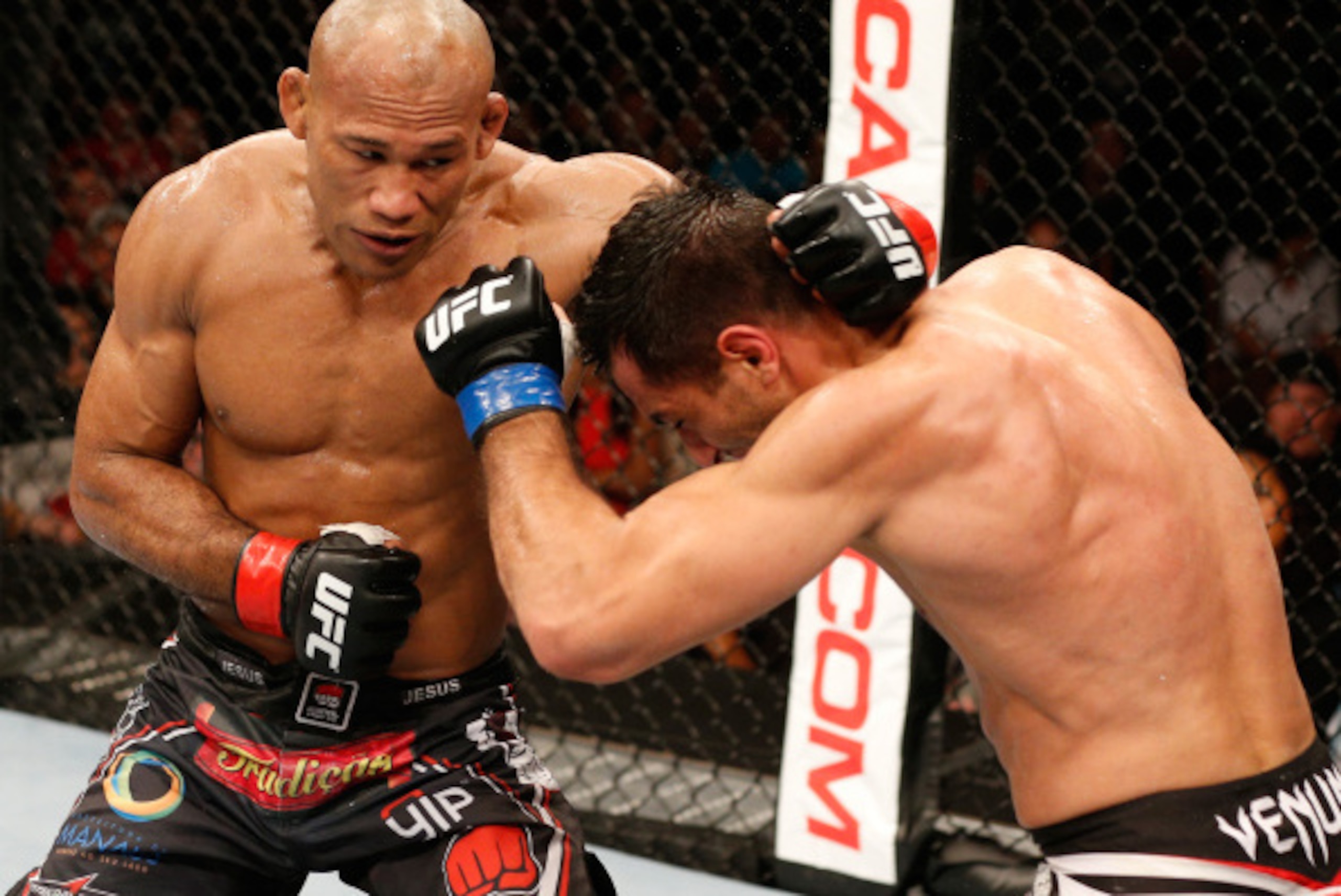 MASHANTUCKET, CT - SEPTEMBER 05:  (L-R) Ronaldo 'Jacare' Souza punches Gegard Mousasi in their middleweight bout during the UFC Fight Night event at Foxwoods Resort Casino on September 5, 2014 in Mashantucket, Connecticut.  (Photo by Josh Hedges/Zuffa LLC