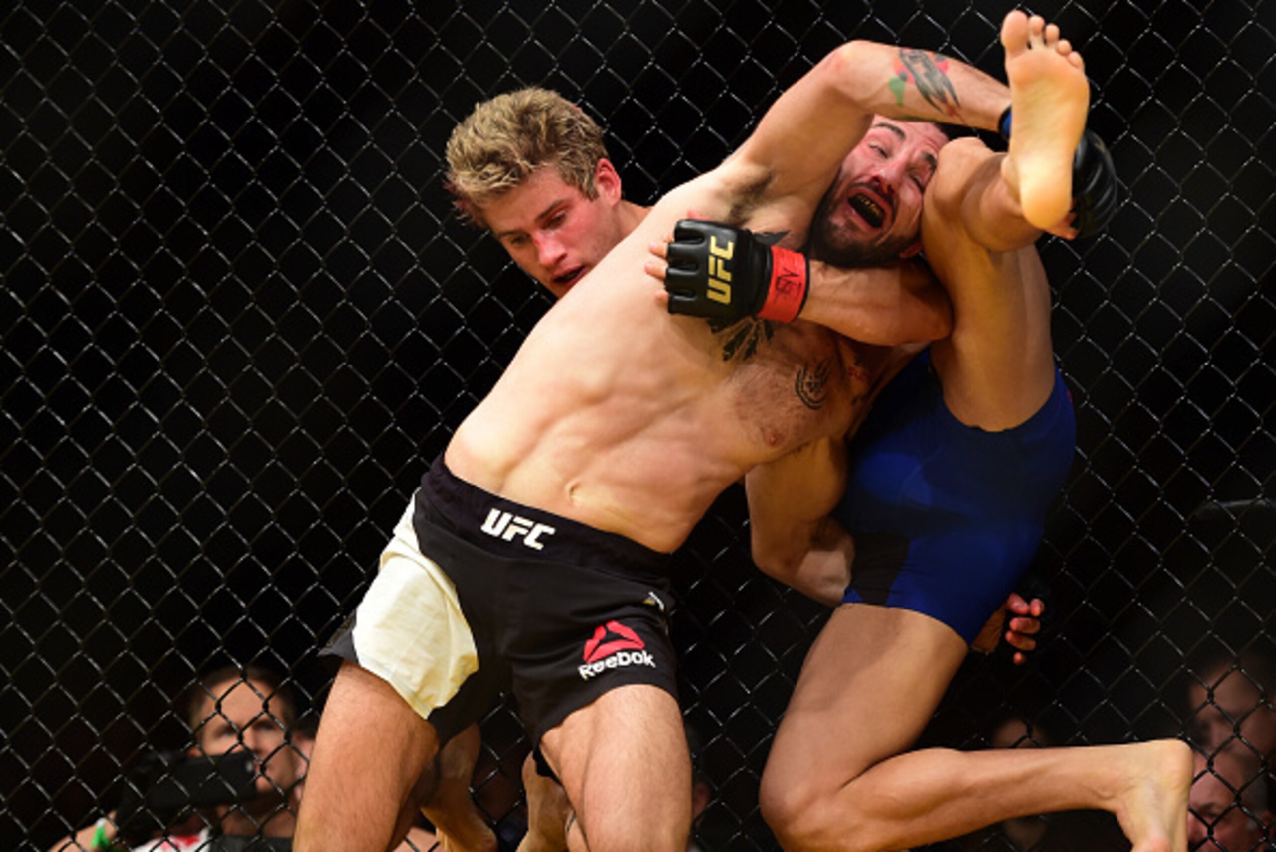 LAS VEGAS, NV - JULY 09: Enrique Marin of Spain (black trunks) takes down Sage Northcutt in their lightweight bout during the UFC 200 event on July 9, 2016 at T-Mobile Arena in Las Vegas, Nevada.  (Photo by Harry How/Zuffa LLC/Zuffa LLC via Getty Images)