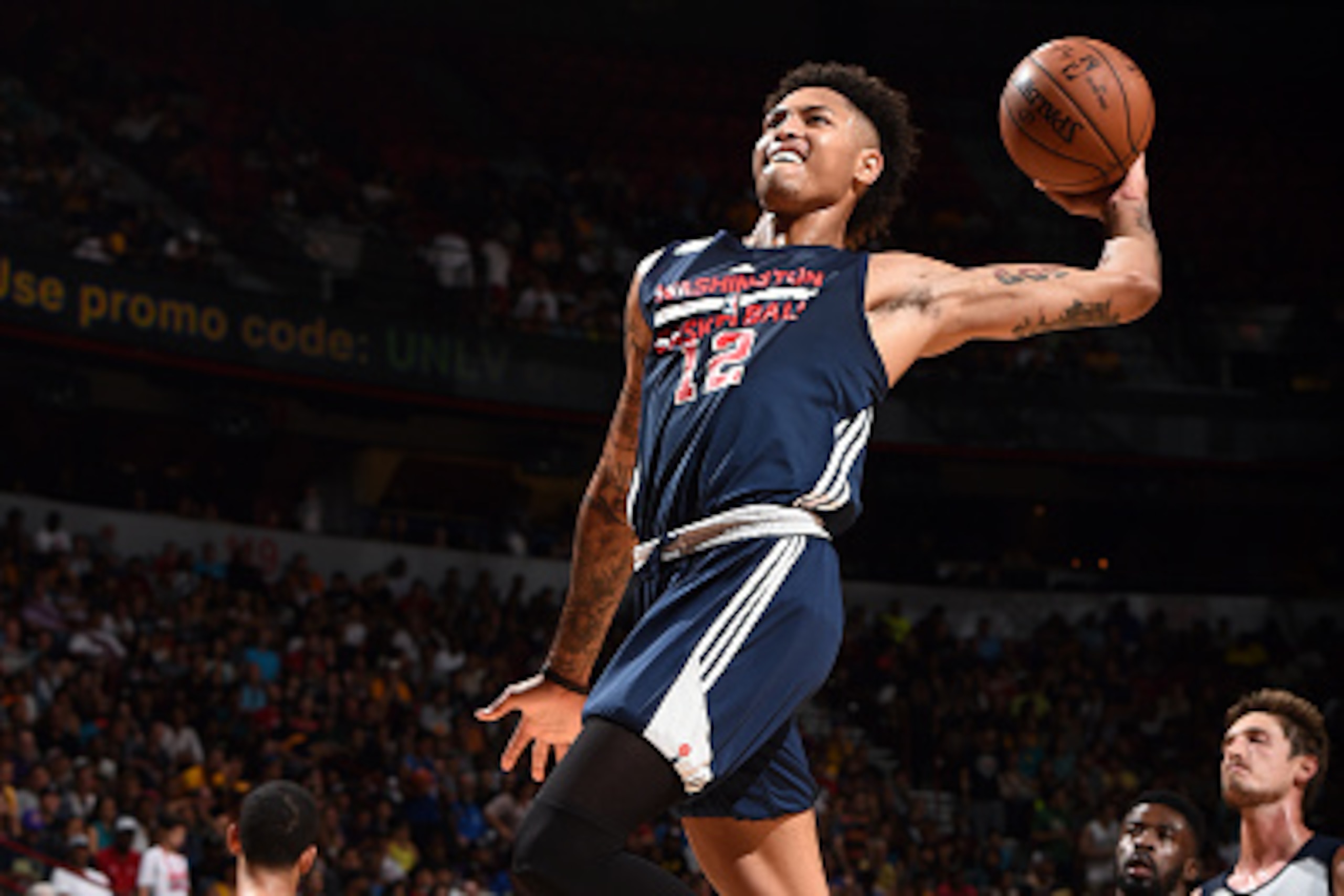 LAS VEGAS, NV - JULY 9: Kelly Oubre Jr. #12 of Washington Wizards goes for the dunk during the game against the Utah Jazz during the 2016 NBA Las Vegas Summer League on July 9, 2016 at The Thomas & Mack Center in Las Vegas, Nevada. NOTE TO USER: User expr