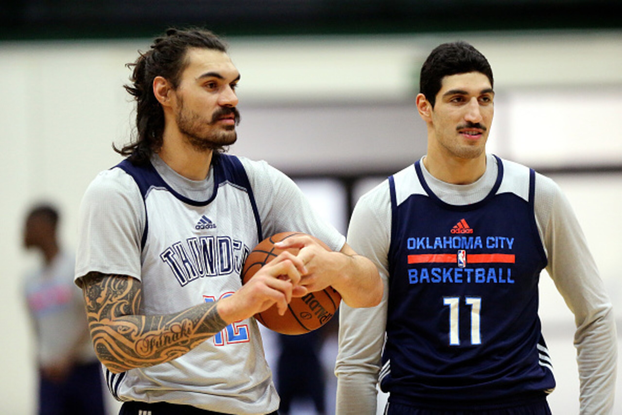 SAN FRANCISCO, CA - MAY 17: Steven Adams #12 and Enes Kanter #11 of the Oklahoma City Thunder looks on during practice during their off day before Game Two of the NBA Western Conference Finals on May 17, 2016 at the University of San Francisco in San Fran