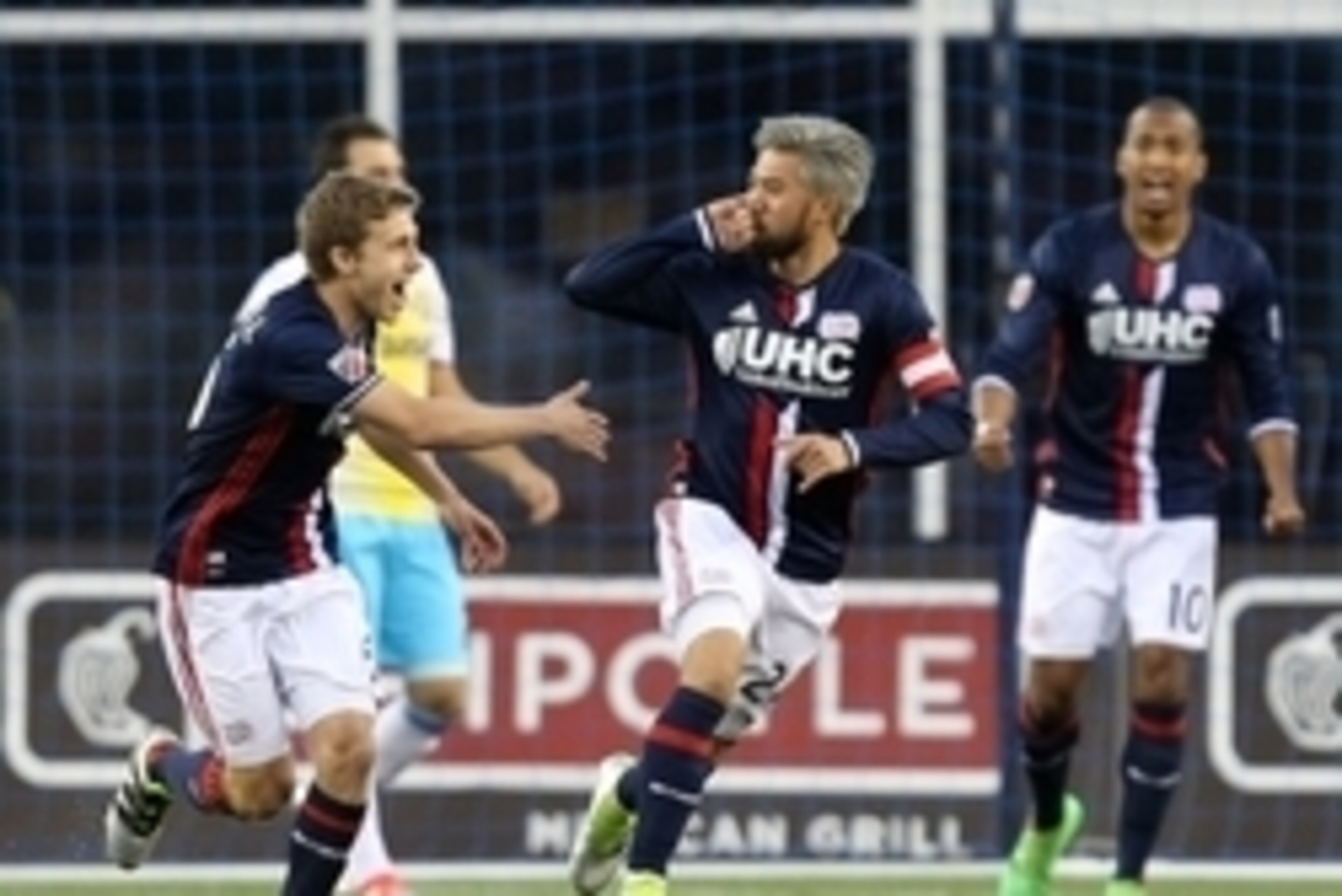 Jul 9, 2016; Foxborough, MA, USA; New England Revolution midfielder Lee Nguyen (center) celebrates his goal against the Columbus Crew during the first half at Gillette Stadium. Mandatory Credit: Mark L. Baer-USA TODAY Sports
