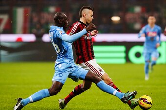 MILAN, ITALY - DECEMBER 14:  Jeremy Menez (R) of AC Milan is challenged by Kalidou Koulibaly (L) of SSC Napoli during the Serie A match between AC Milan and SSC Napoli at Stadio Giuseppe Meazza on December 14, 2014 in Milan, Italy.  (Photo by Marco Luzzan