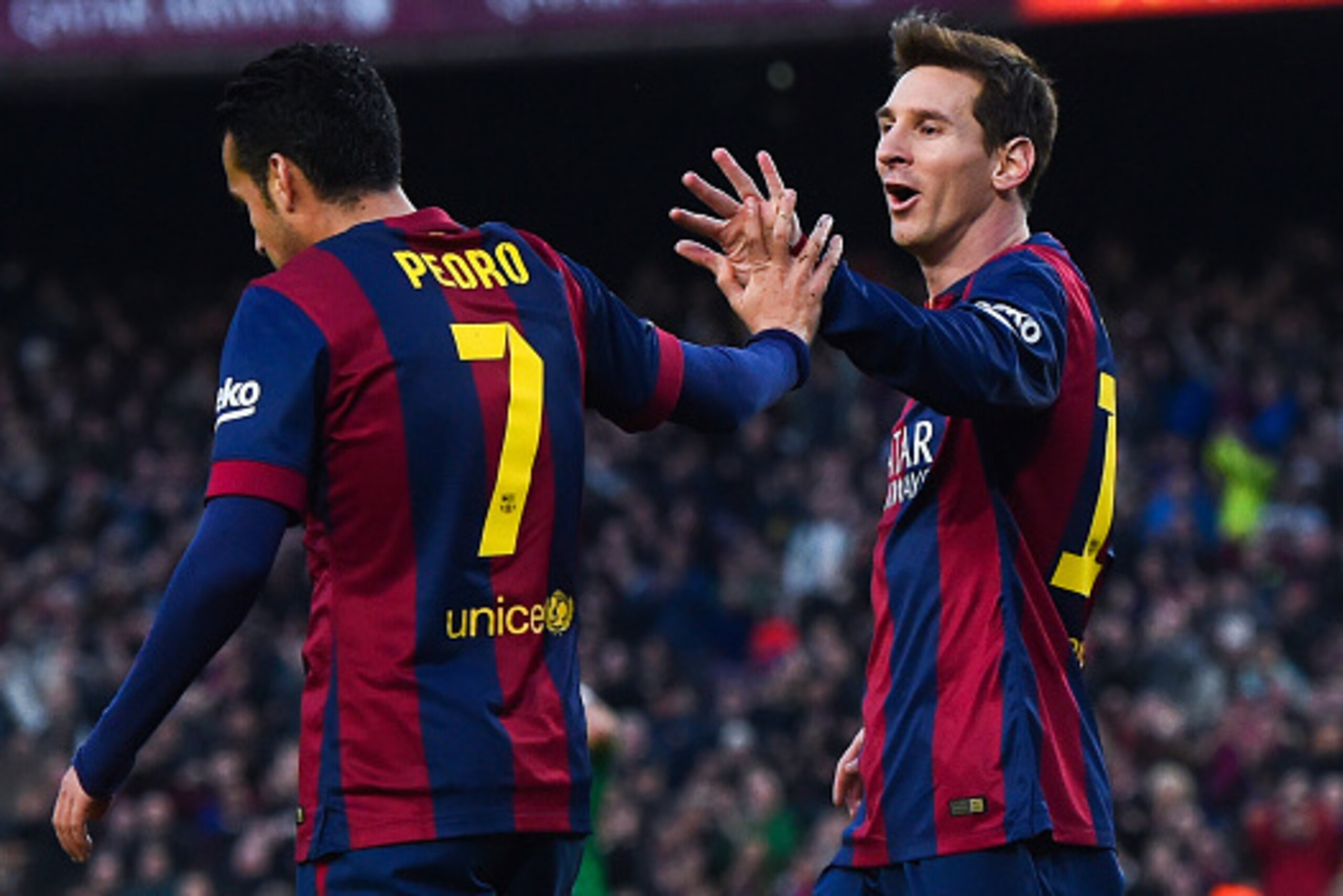 BARCELONA, SPAIN - FEBRUARY 15:  Lionel Messi of FC Barcelona celebrates with his teammate Pedro Rodriguez of FC Barcelona after scoring his team's third goal during the La Liga match between FC Barcelona and Levante UD at Camp Nou on February 15, 2015 in