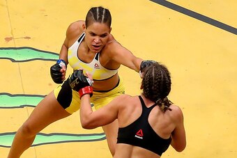 LAS VEGAS, NV - JULY 09: Amanda Nunes of Brazil (top) punches Miesha Tate during the UFC 200 event on July 9, 2016 at T-Mobile Arena in Las Vegas, Nevada.  (Photo by Ed Mulholland/Zuffa LLC/Zuffa LLC via Getty Images)