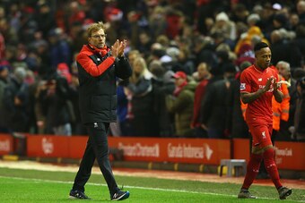 LIVERPOOL, ENGLAND - DECEMBER 13:  Jurgen Klopp, manager of Liverpool and Nathaniel Clyne (R) applaud the crowd after the Barclays Premier League match between Liverpool and West Bromwich Albion at Anfield on December 13, 2015 in Liverpool, England.  (Pho
