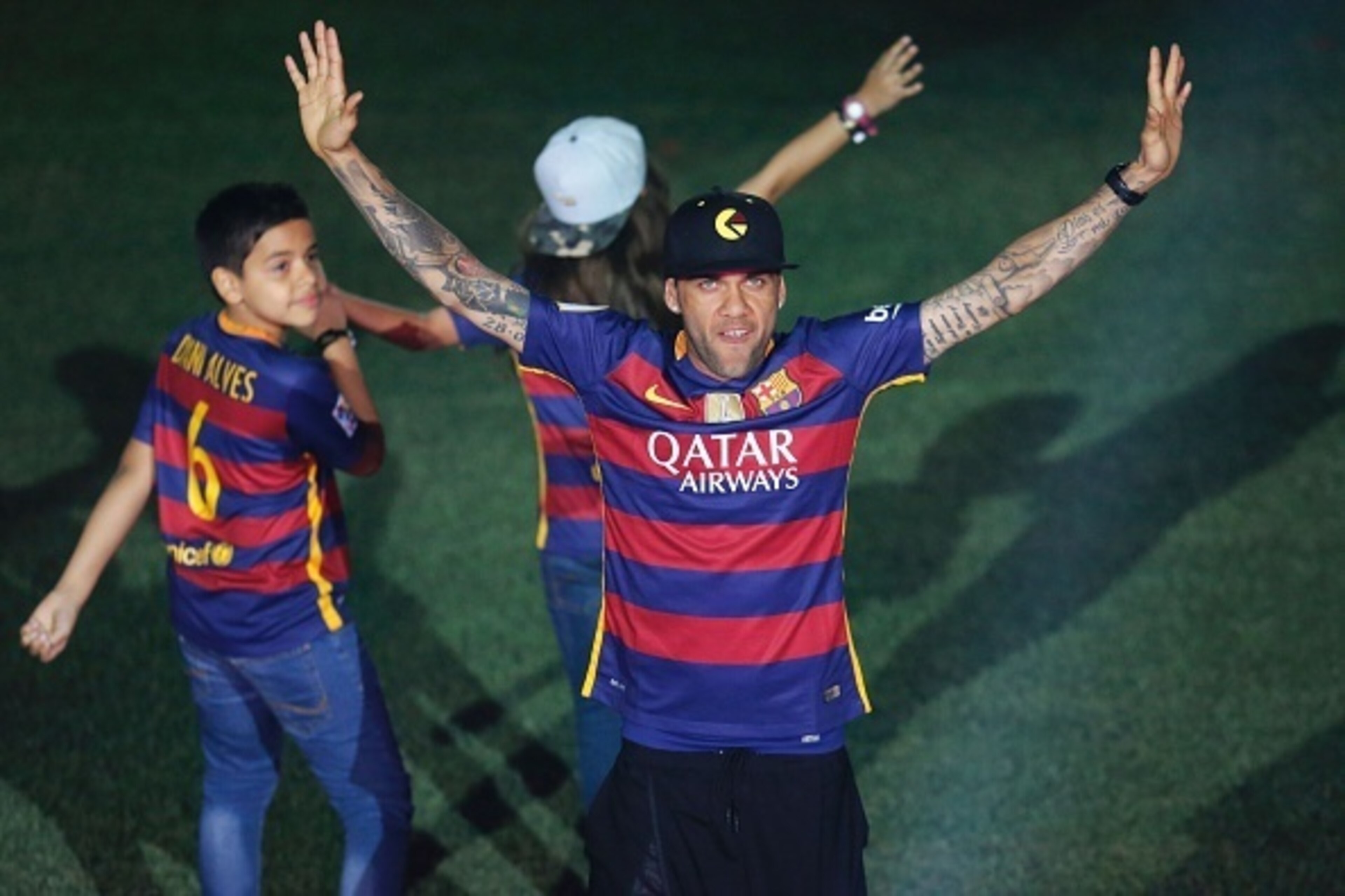 Barcelona's Brazilian defender Dani Alves acknowledges the crowd during celebrations at the Camp Nou stadium in Barcelona on May 23, 2016 following their Spanish 'Copa del Rey' (King's Cup) final football match 2-0 victory over Sevilla FC yesterday also m