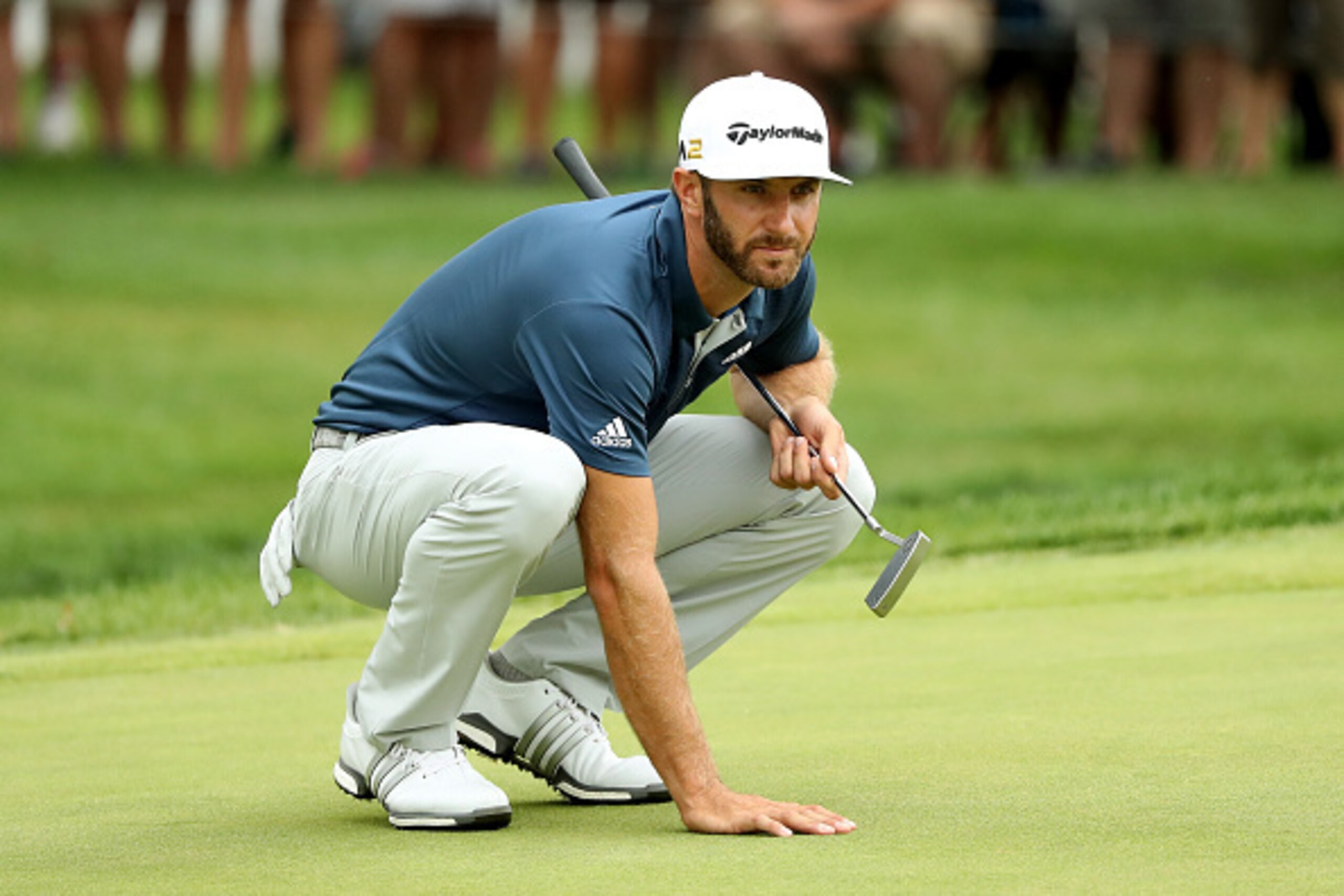AKRON, OH - JULY 03:  Dustin Johnson lines up a putt on the 18th green during the final round of the World Golf Championships - Bridgestone Invitational at Firestone Country Club South Course on July 3, 2016 in Akron, Ohio.  (Photo by Mike Lawrie/Getty Im