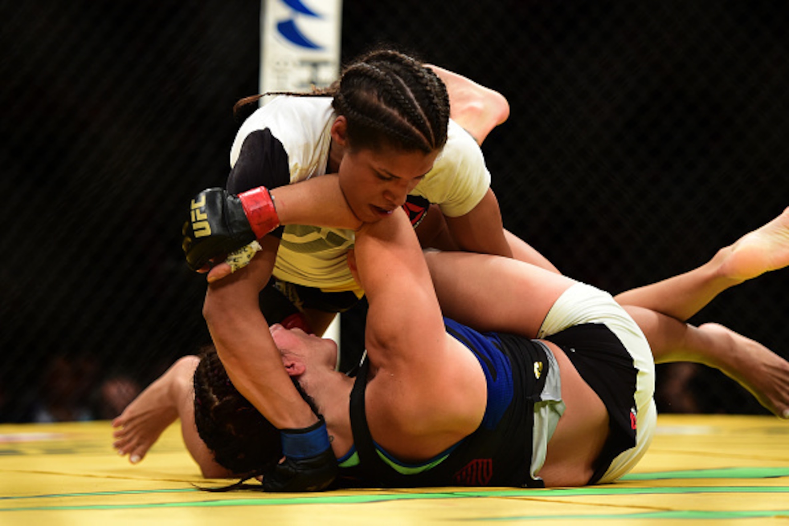LAS VEGAS, NV - JULY 09:  (Top) Julianna Pena grapples with Cat Zingano in their women's bantamweight bout during the UFC 200 event on July 9, 2016 at T-Mobile Arena in Las Vegas, Nevada.  (Photo by Harry How/Zuffa LLC/Zuffa LLC via Getty Images)