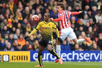 WATFORD, ENGLAND - MARCH 19:  Odion Ighalo of Watford controls the ball under pressure of Marc Muniesa of Stoke City during the Barclays Premier League match between Watford and Stoke City at Vicarage Road on March 19, 2016 in Watford, United Kingdom.  (P