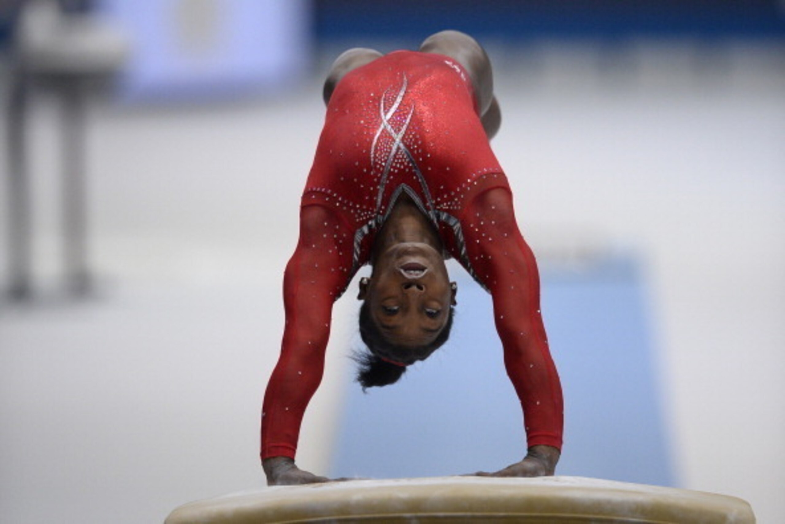 US gymnast Simone Biles competes in the vault qualifications at the 44th Artistic Gymnastics World Championships in Antwerp on October 2, 2013 . AFP PHOTO MARTIN BUREAU        (Photo credit should read MARTIN BUREAU/AFP/Getty Images)