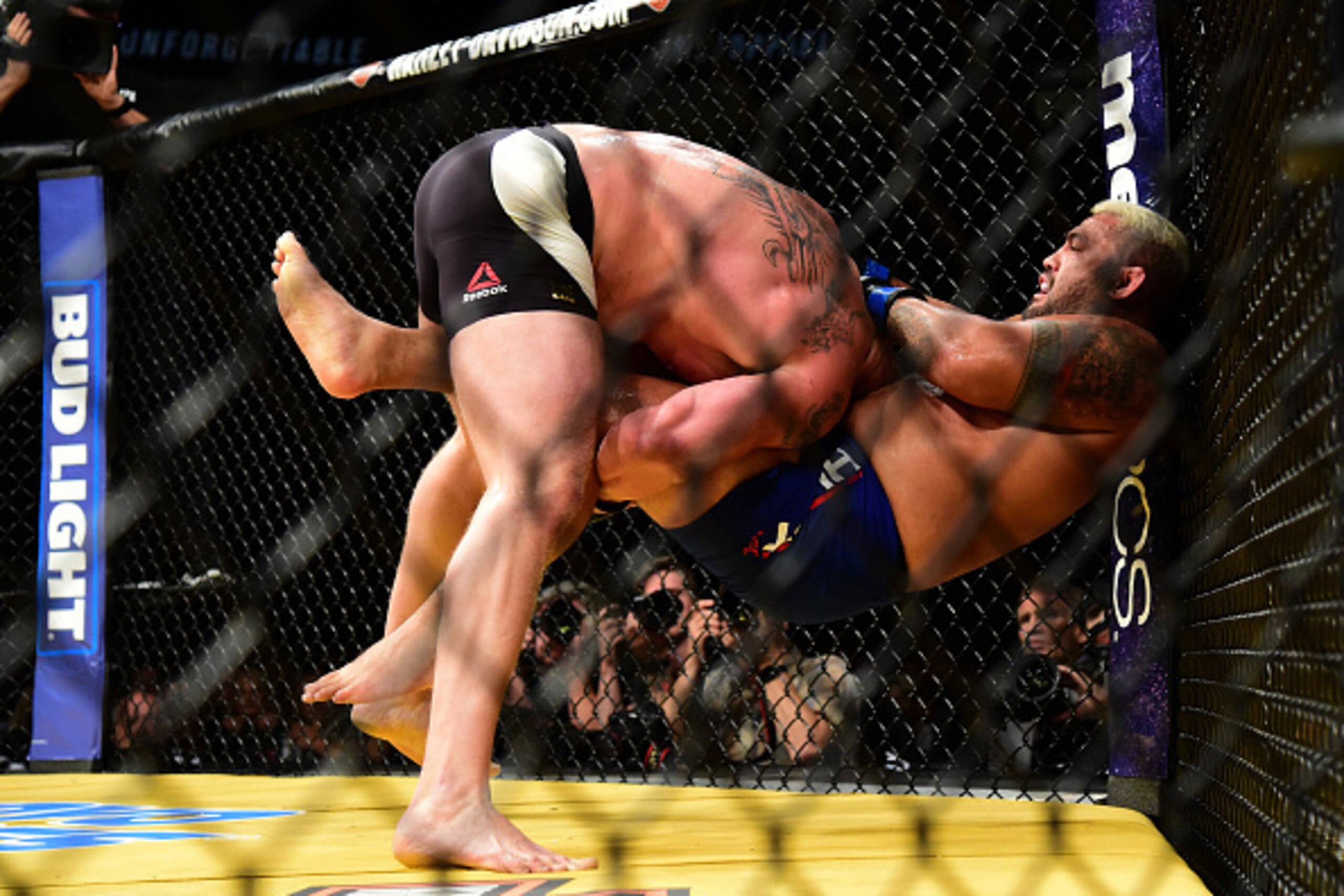 LAS VEGAS, NV - JULY 09: (L-R) Brock Lesnar takes down Mark Hunt of New Zealand in their heavyweight bout during the UFC 200 event on July 9, 2016 at T-Mobile Arena in Las Vegas, Nevada.  (Photo by Harry How/Zuffa LLC/Zuffa LLC via Getty Images)