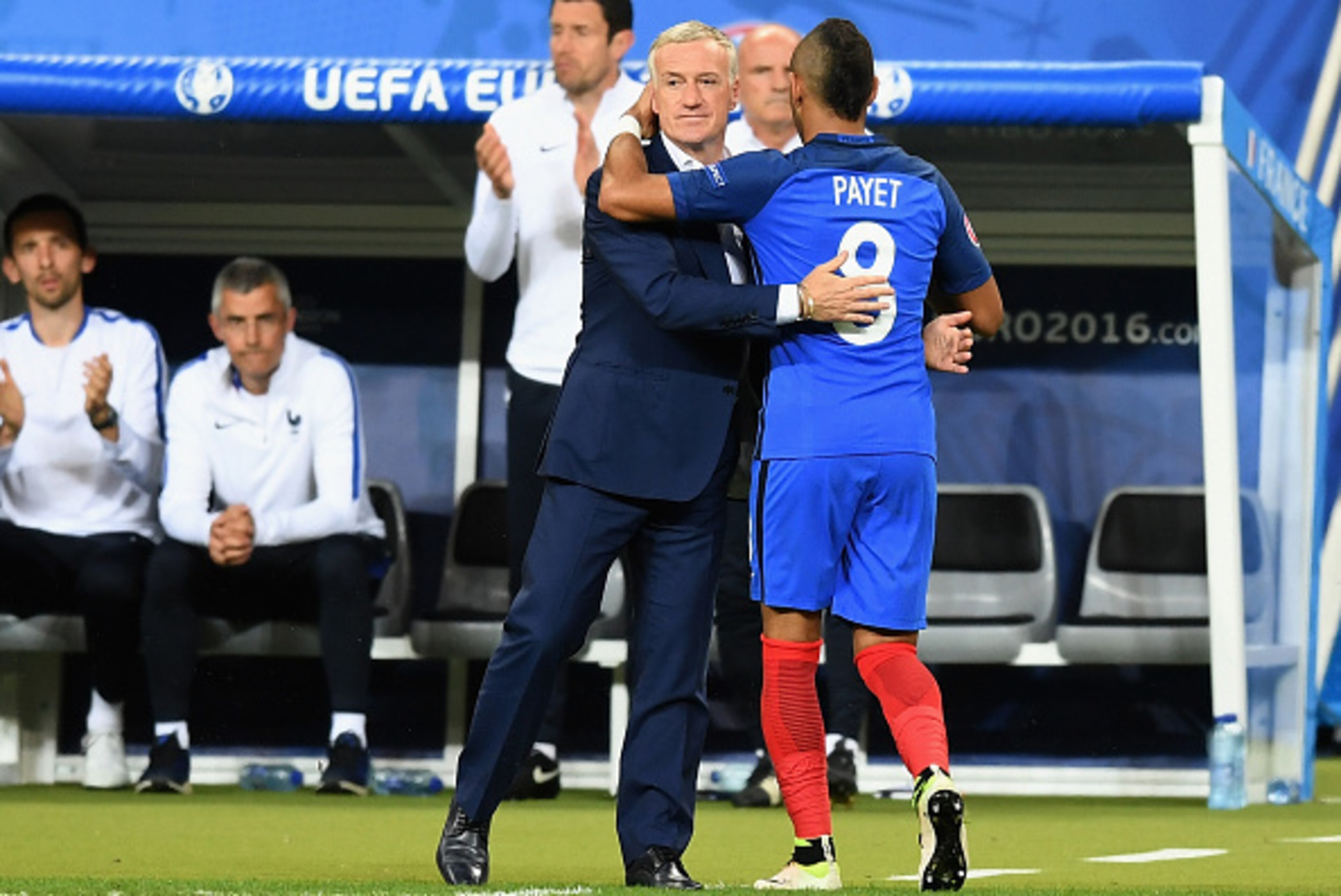 PARIS, FRANCE - JULY 10:  Dimitri Payet of France is congratulated by manager Didier Deschamps after being substituted during the UEFA EURO 2016 Final match between Portugal and France at Stade de France on July 10, 2016 in Paris, France.  (Photo by Micha