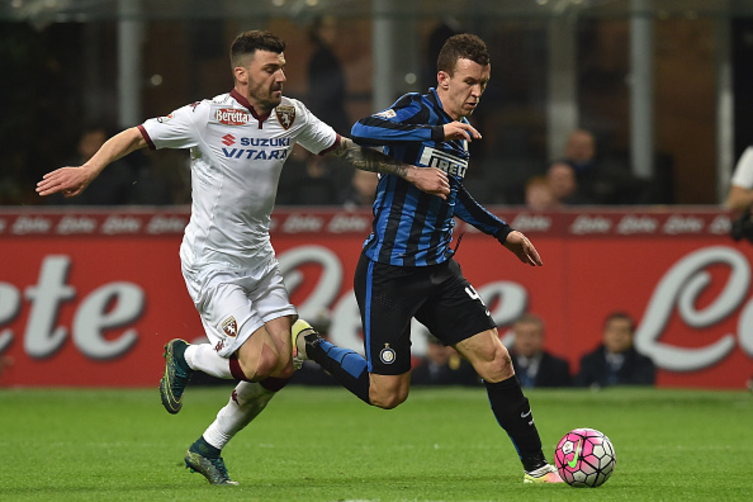 MILAN, ITALY - APRIL 03: Ivan Perisic (R) of FC Internazionale Milano is challenged by Cesare Bovo of Torino FC during the Serie A match between FC Internazionale and Torino FC Milano at Stadio Giuseppe Meazza on April 3, 2016 in Milan, Italy. (Photo b MILAN, ITALY - APRIL 03: Ivan Perisic (R) of FC Internazionale Milano is challenged by Cesare Bovo of Torino FC during the Serie A match between FC Internazionale and Torino FC Milano at Stadio Giuseppe Meazza on April 3, 2016 in Milan, Italy. (Photo b