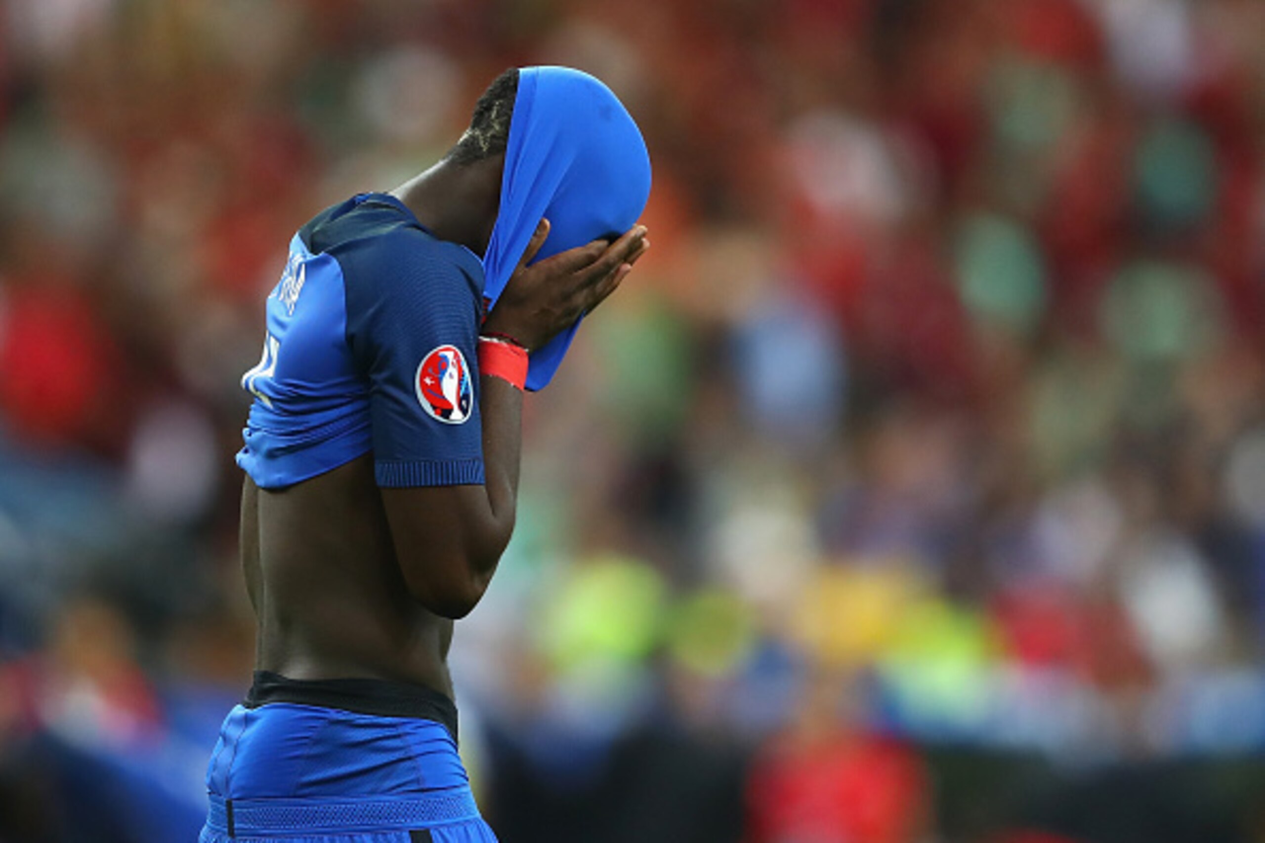 PARIS, FRANCE - JULY 10:  Paul Pogba of France shows his dejection after his team's 0-1 defeat in the UEFA EURO 2016 Final match between Portugal and France at Stade de France on July 10, 2016 in Paris, France.  (Photo by Lars Baron/Getty Images)