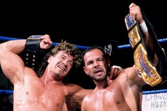 Eddie and Chavo Guerrero celebrate winning the tag team titles.