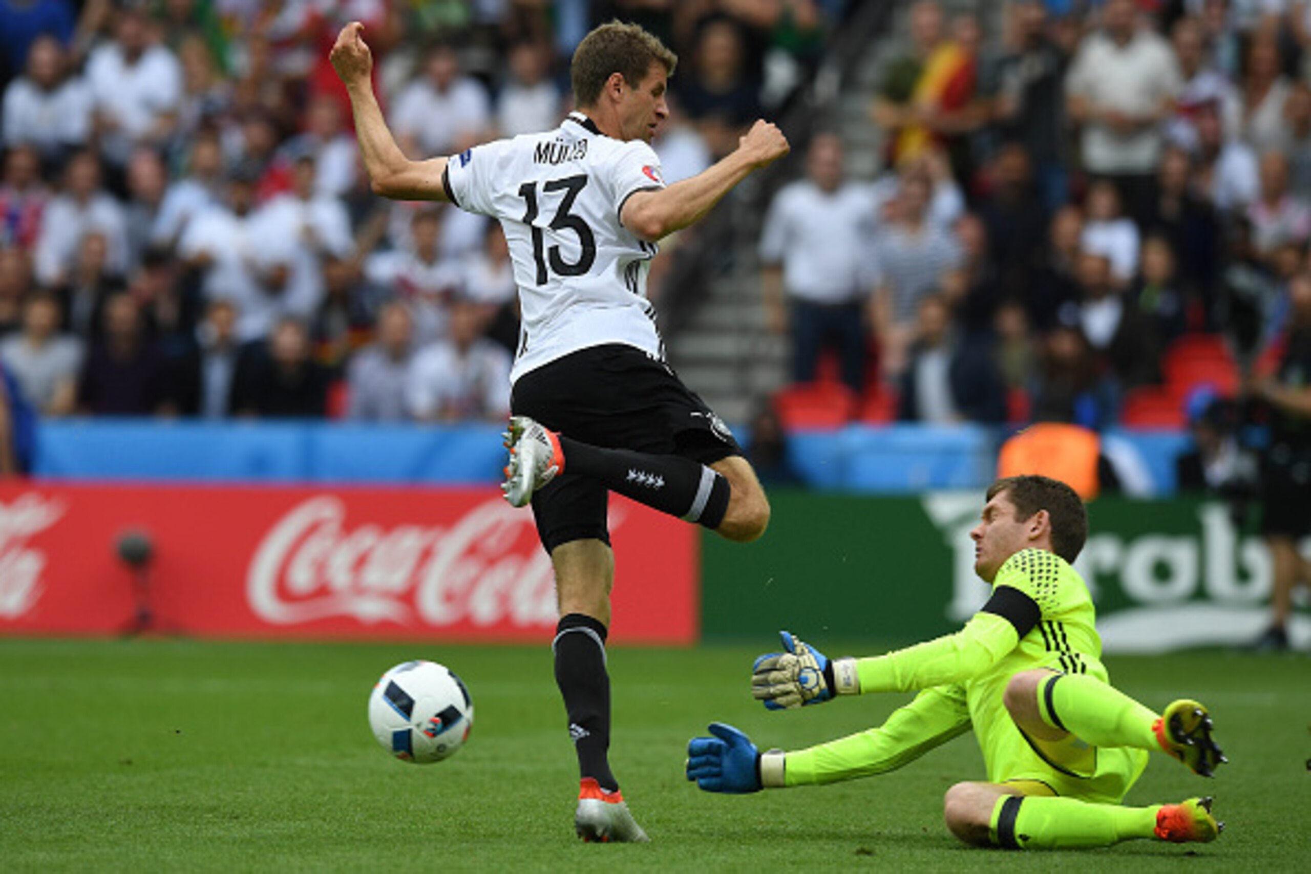 PARIS, FRANCE - JUNE 21: Michael McGovern (R) of Northern Ireland and Thomas Muller (L) of Germany during the UEFA EURO 2016 Group C match between Northern Ireland and Germany at Parc des Princes on June 21, 2016 in Paris, France. (Photo by Charles McQuil