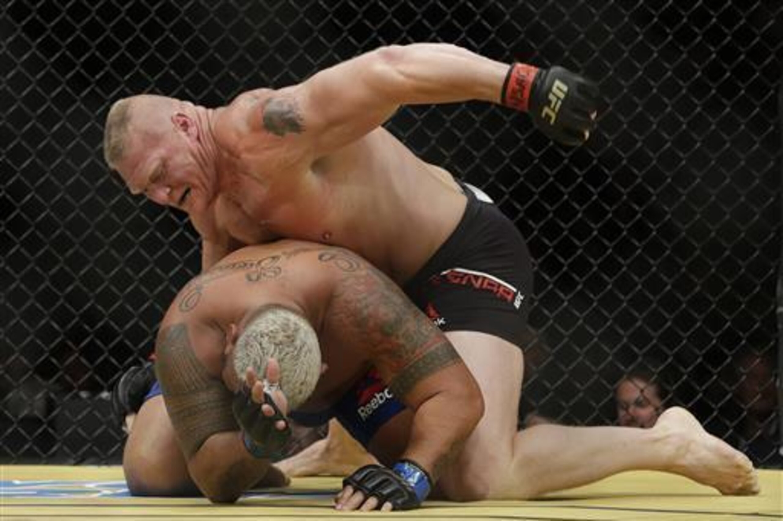 Brock Lesnar in control of Mark Hunt.