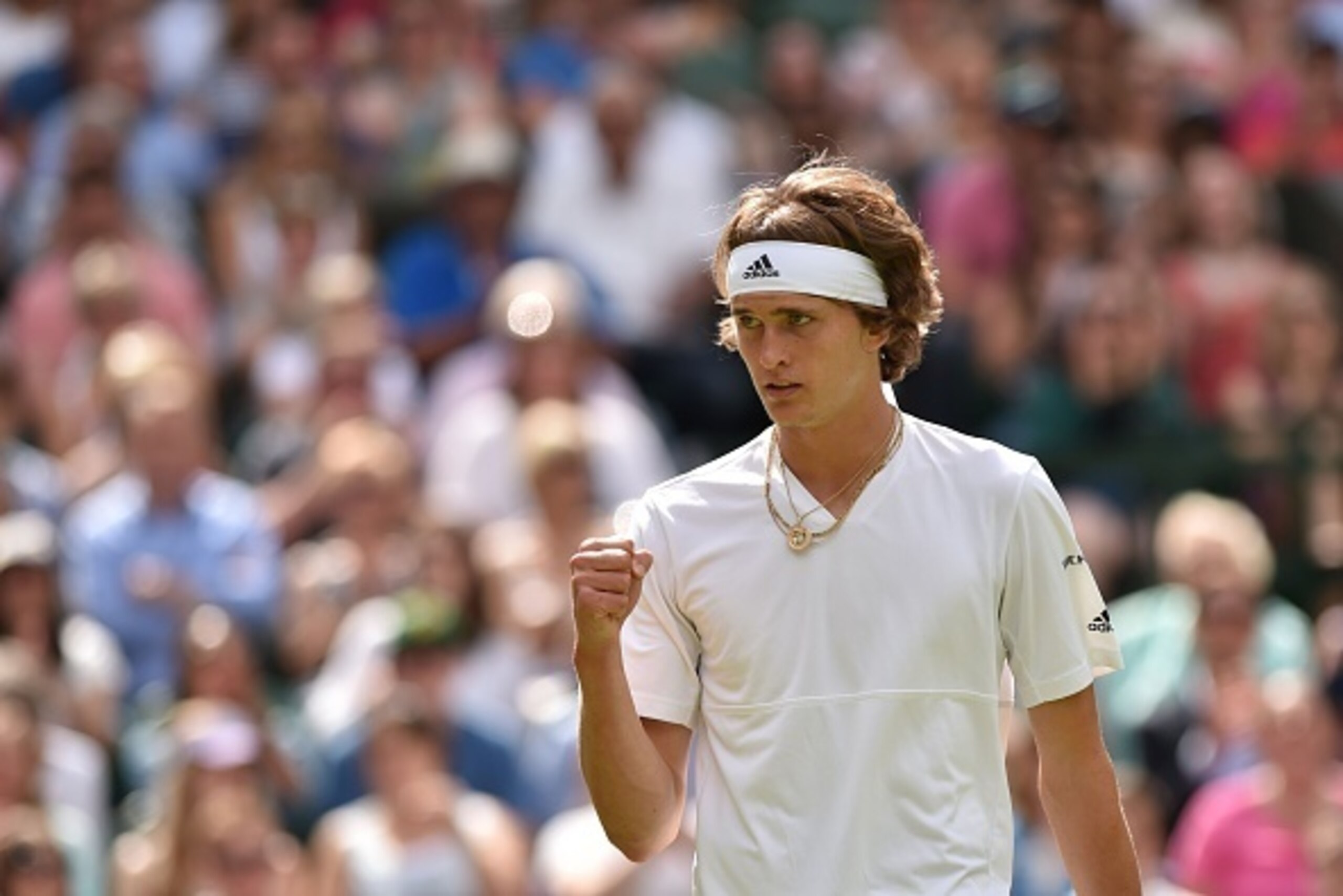 Germany's Alexander Zverev celebrates a point against Czech Republic's Tomas Berdych during their men's singles third round match on the seventh day of the 2016 Wimbledon Championships at The All England Lawn Tennis Club in Wimbledon, southwest London, on