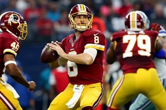 ARLINGTON, TX - JANUARY 03: Kirk Cousins #8 of the Washington Redskins looks for an open receiver against the Dallas Cowboys during the first quarter at AT&T Stadium on January 3, 2016 in Arlington, Texas. (Photo by Tom Pennington/Getty Images)