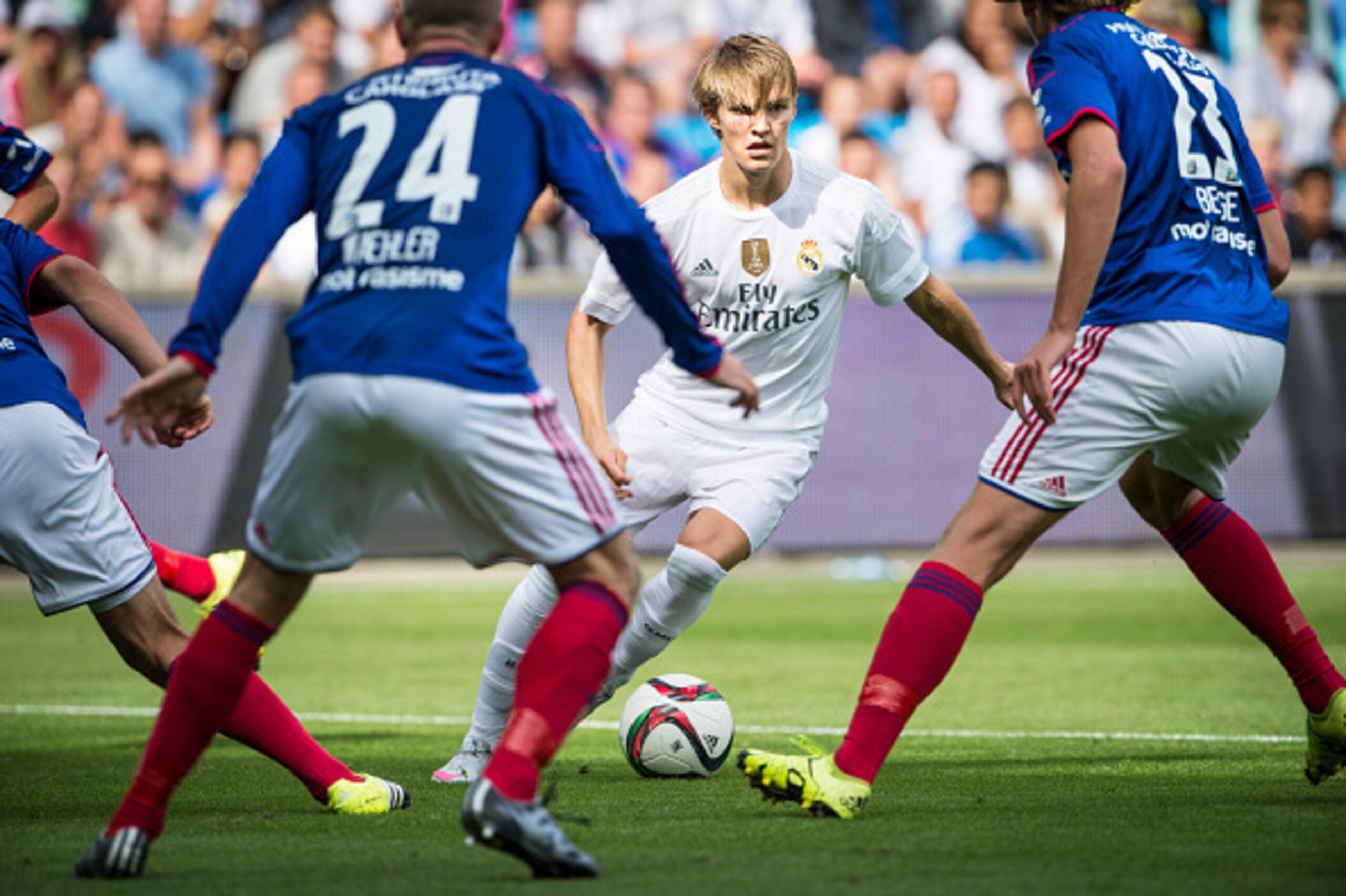 OSLO, NORWAY - August 9: Martin Odegaard  of Real Madrid, Kjetil Whaeler and Sander Berge of Vaalerenga  during  Pre-season Friendly  match between Vaalerenga and Real Madrid at Ullevaal Stadion on August  9, 2015 in Oslo, Norway.  (Photo by Trond Tandber