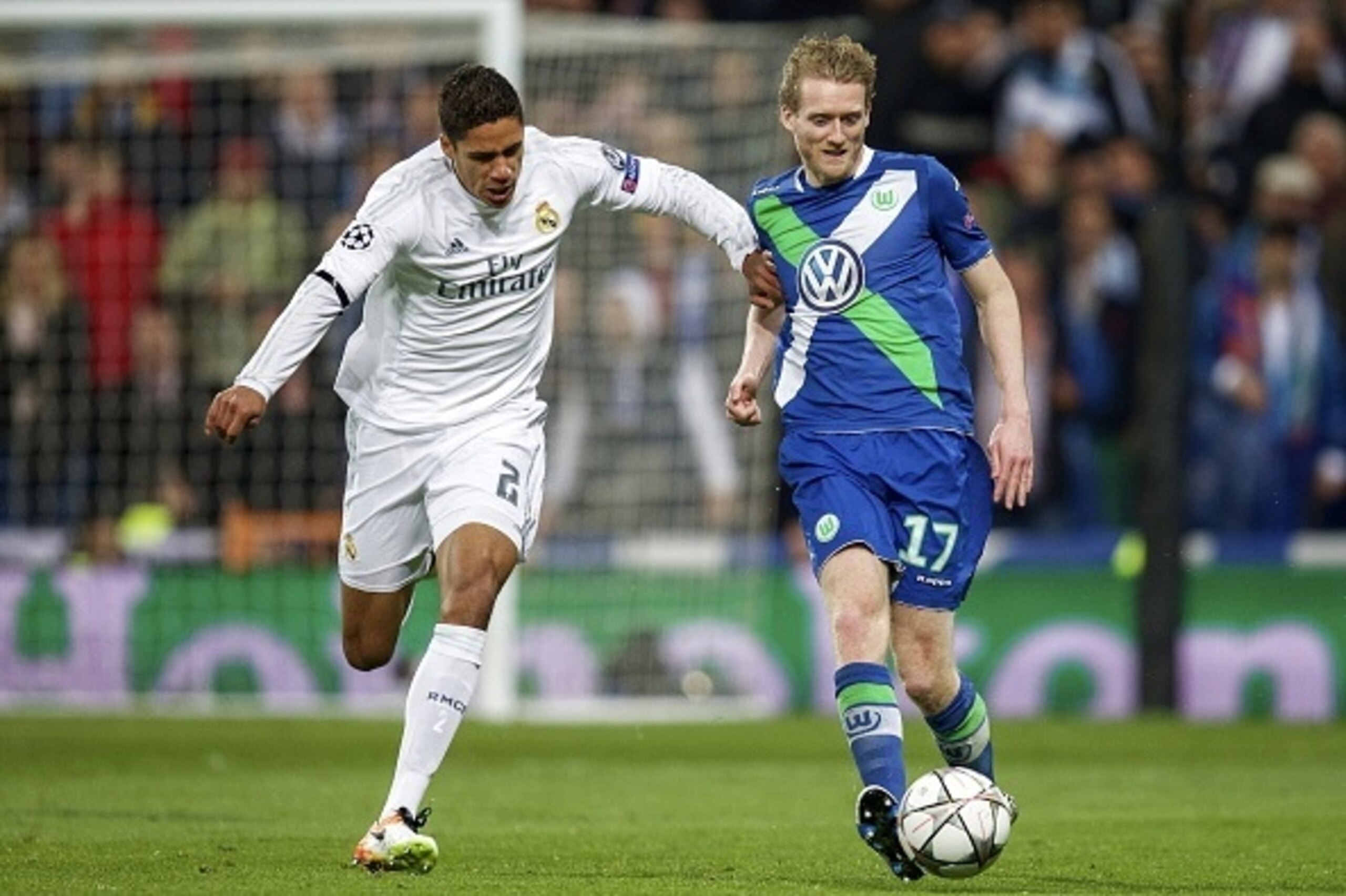 (L-R) Raphael Varane of Real Madrid, Andre Schurrle of Vfl Wolfsburg during the UEFA Champions League quarter-final match between  Real Madrid and VfL Wolfsburg on April 12, 2016 at the Santiago Bernabeu stadium in Madrid, Spain.(Photo by VI Images via Ge