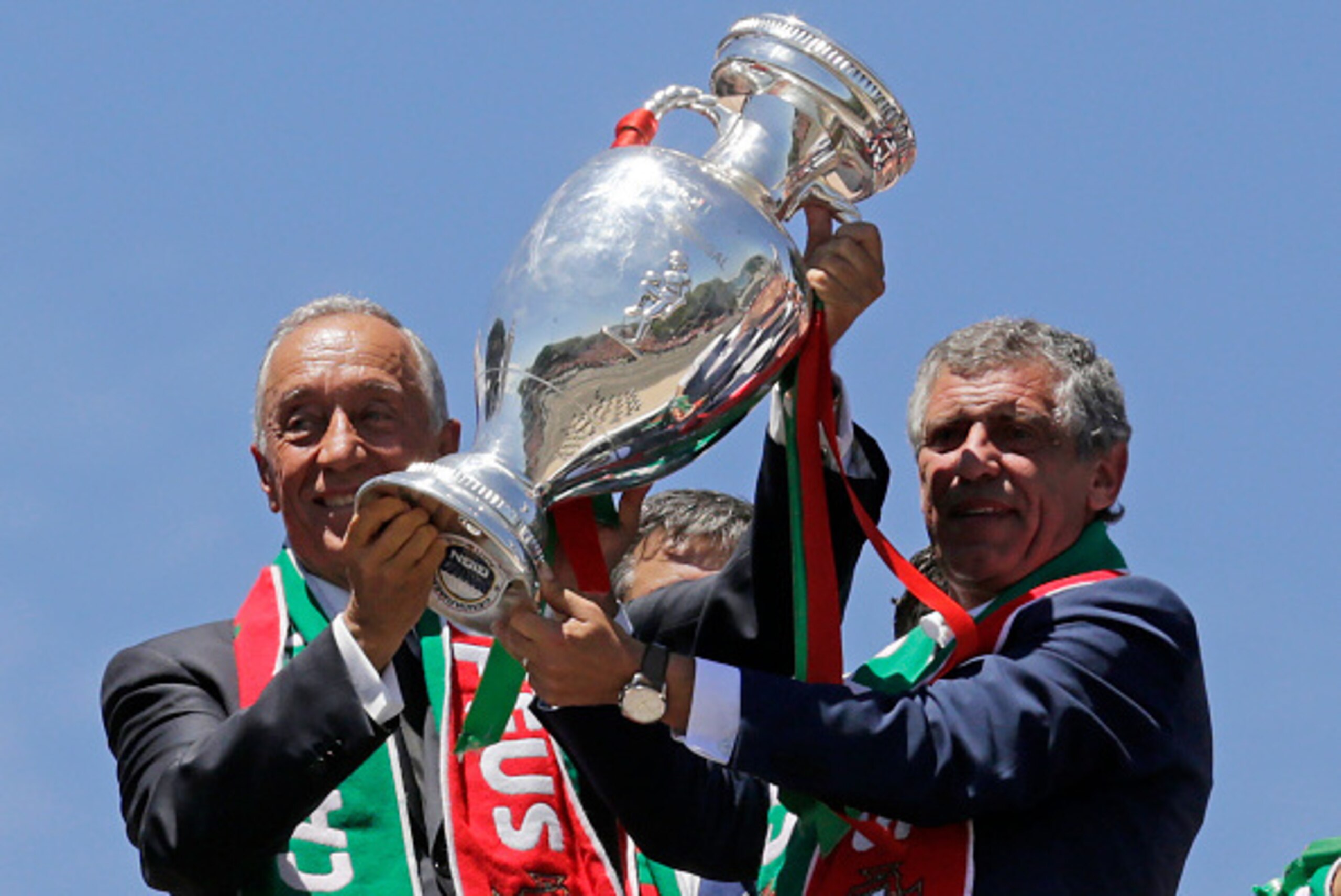 Portugal's president Marcelo Rebelo de Sousa (L) and Portugal's coach Fernando Santos hold the trophy on the balcony of the Belem Palace as they celebrate their victory on July 11, 2016 after their Euro 2016 final football win over France yesterday.
The P Portugal's president Marcelo Rebelo de Sousa (L) and Portugal's coach Fernando Santos hold the trophy on the balcony of the Belem Palace as they celebrate their victory on July 11, 2016 after their Euro 2016 final football win over France yesterday.
The P