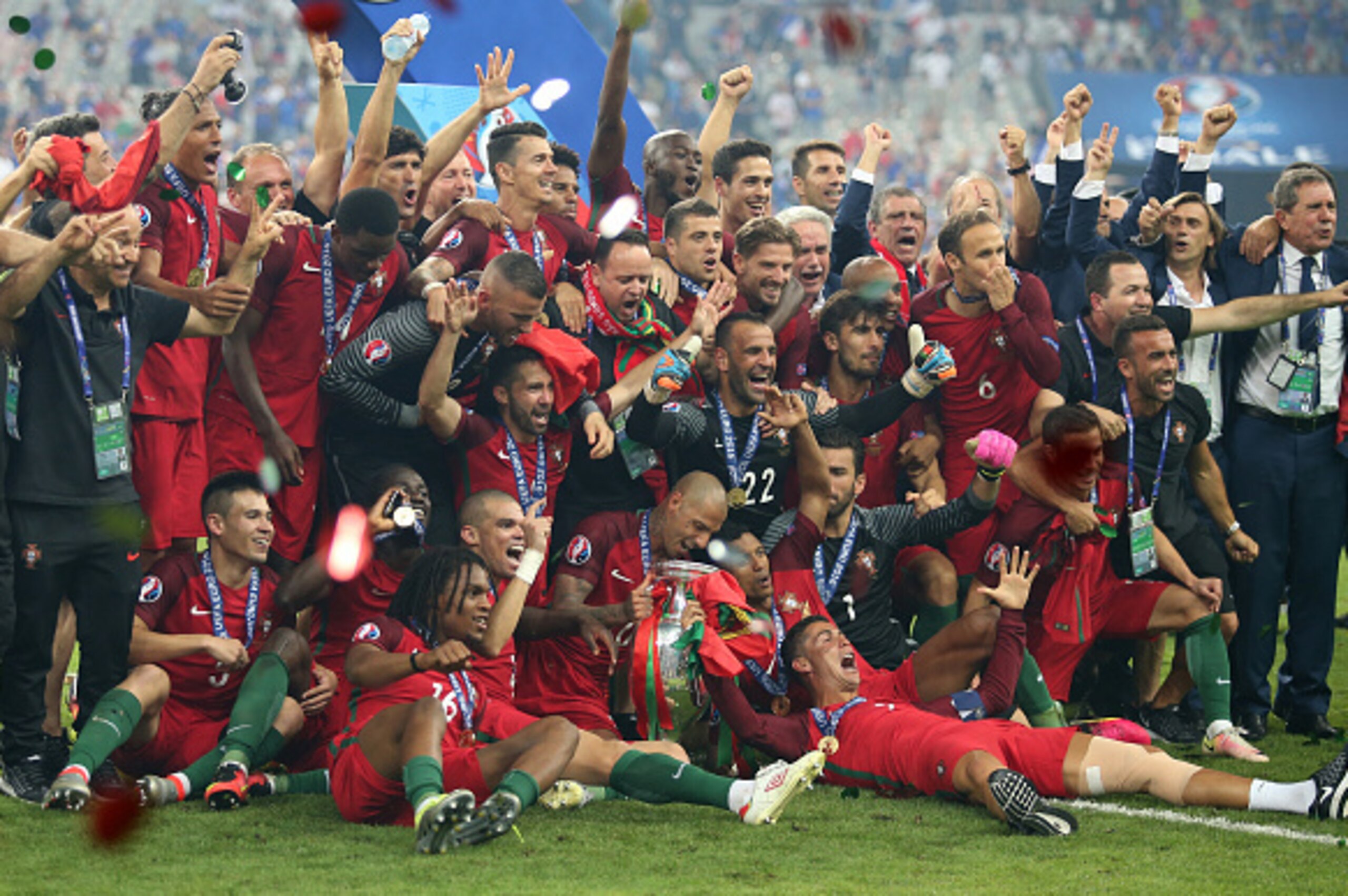 PARIS, FRANCE - JULY 10: Pepe, Ricardo Quaresma, Cristiano Ronaldo (bottom) of Portugal and teammates celebrate the victory during the trophy ceremony following the UEFA Euro 2016 final between Portugal and France at Stade de France on July 10, 2016 in Sa PARIS, FRANCE - JULY 10: Pepe, Ricardo Quaresma, Cristiano Ronaldo (bottom) of Portugal and teammates celebrate the victory during the trophy ceremony following the UEFA Euro 2016 final between Portugal and France at Stade de France on July 10, 2016 in Sa